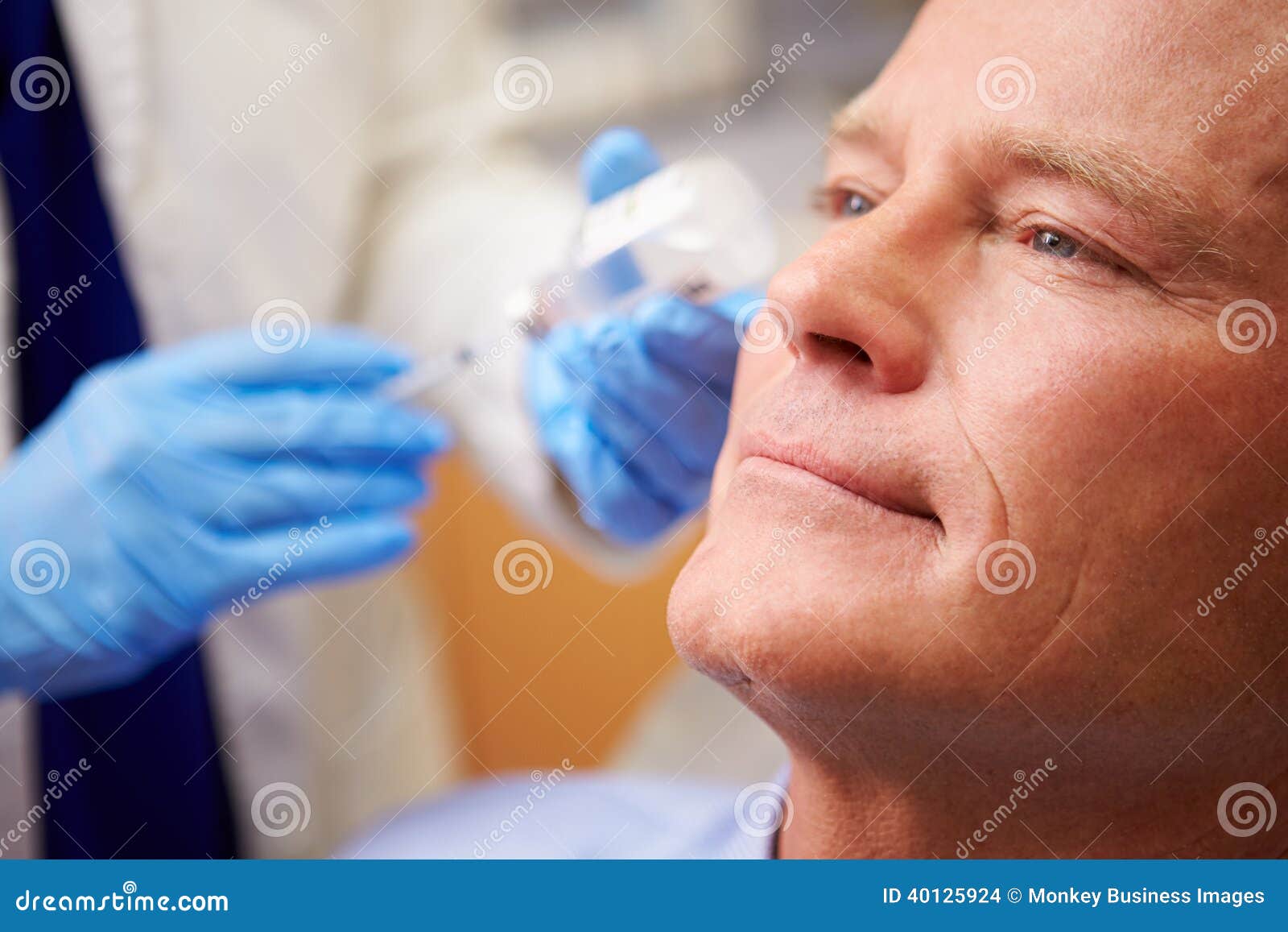 man having botox treatment at beauty clinic