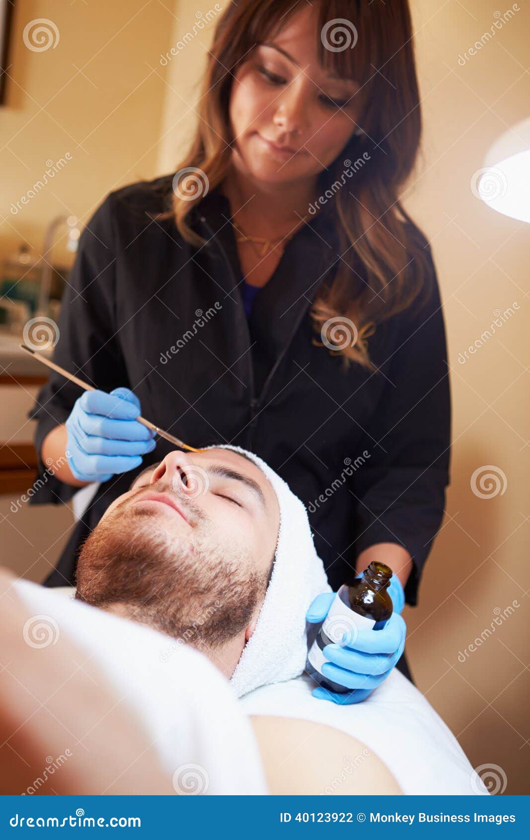 man having dermo abrasion cosmetic treatment at spa