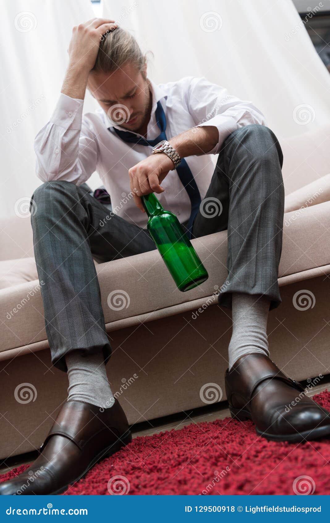 Man having headache after stock photo. Image of drink 129500918