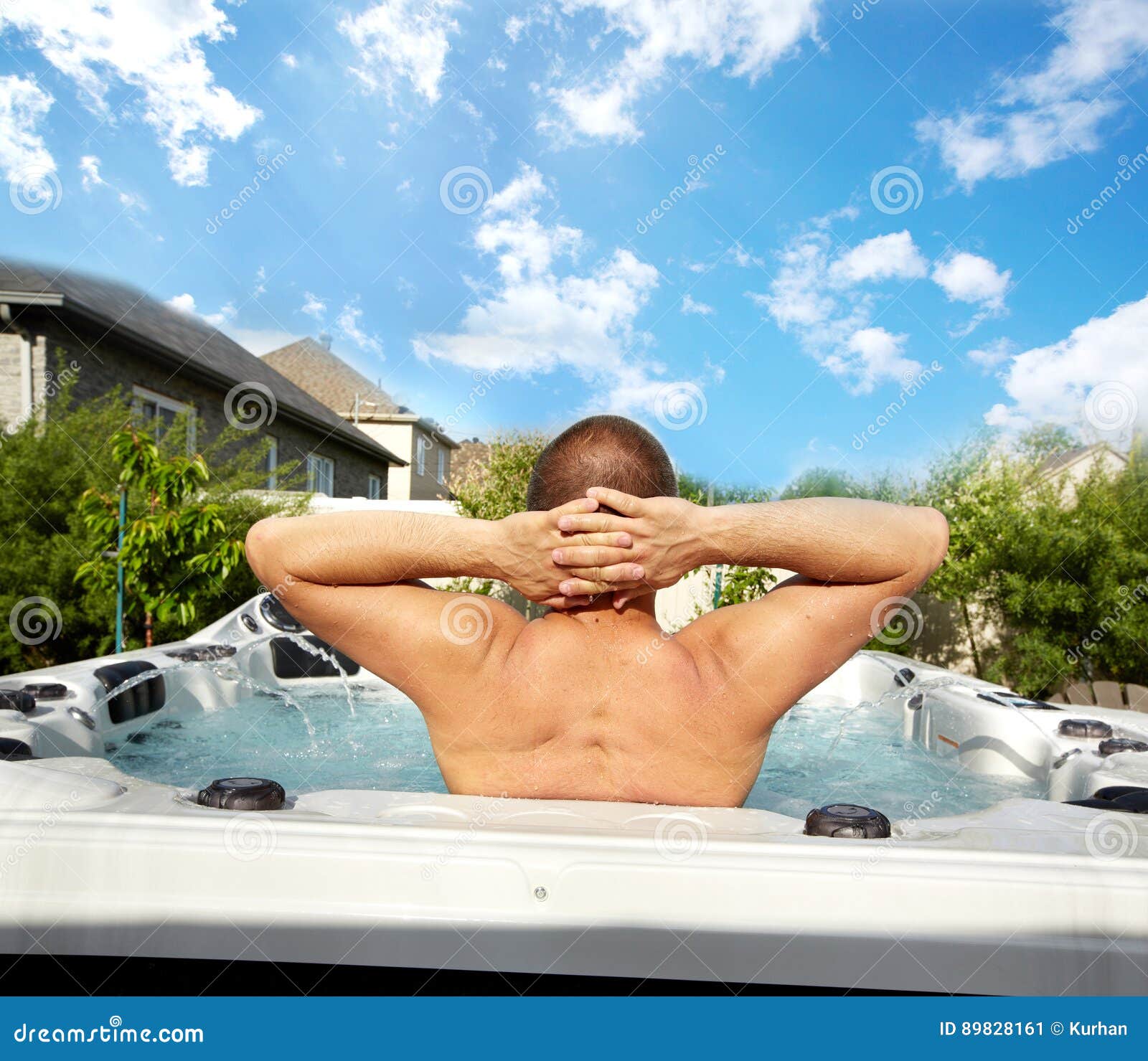 man having massage in hot tub spa.