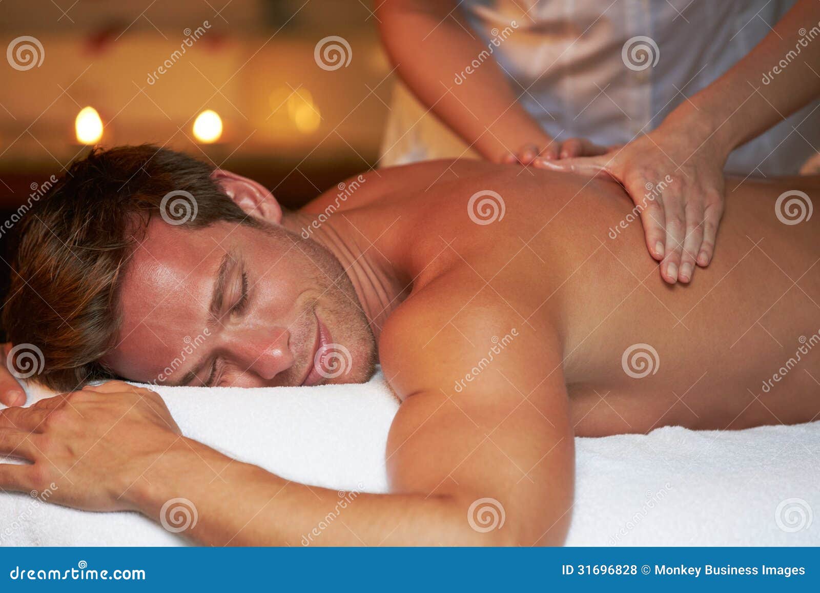 Man Having Massage in Spa stock photo