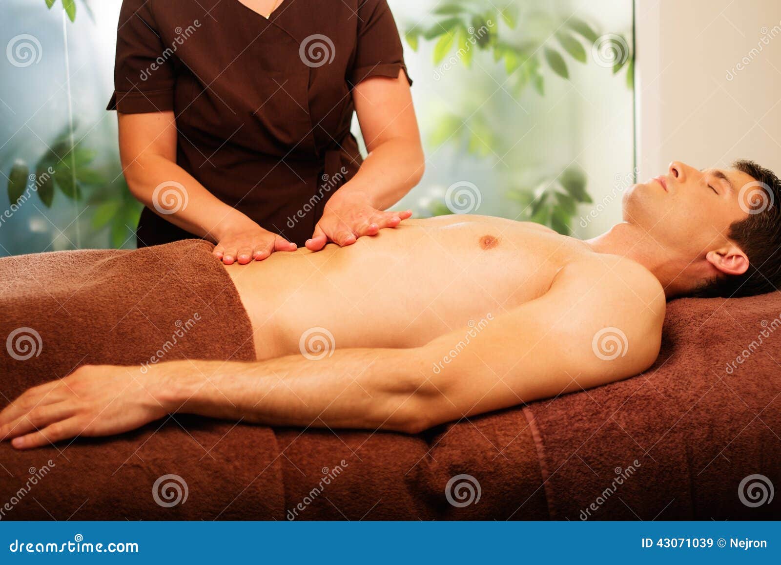 man having massage in a spa