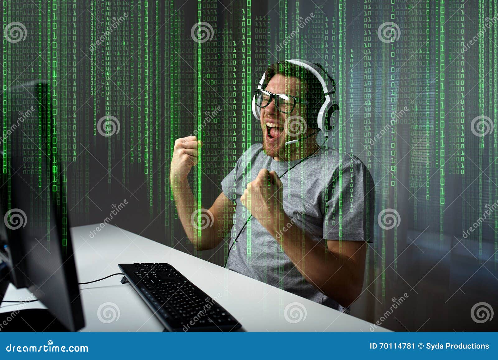 man in headset playing computer video game at home