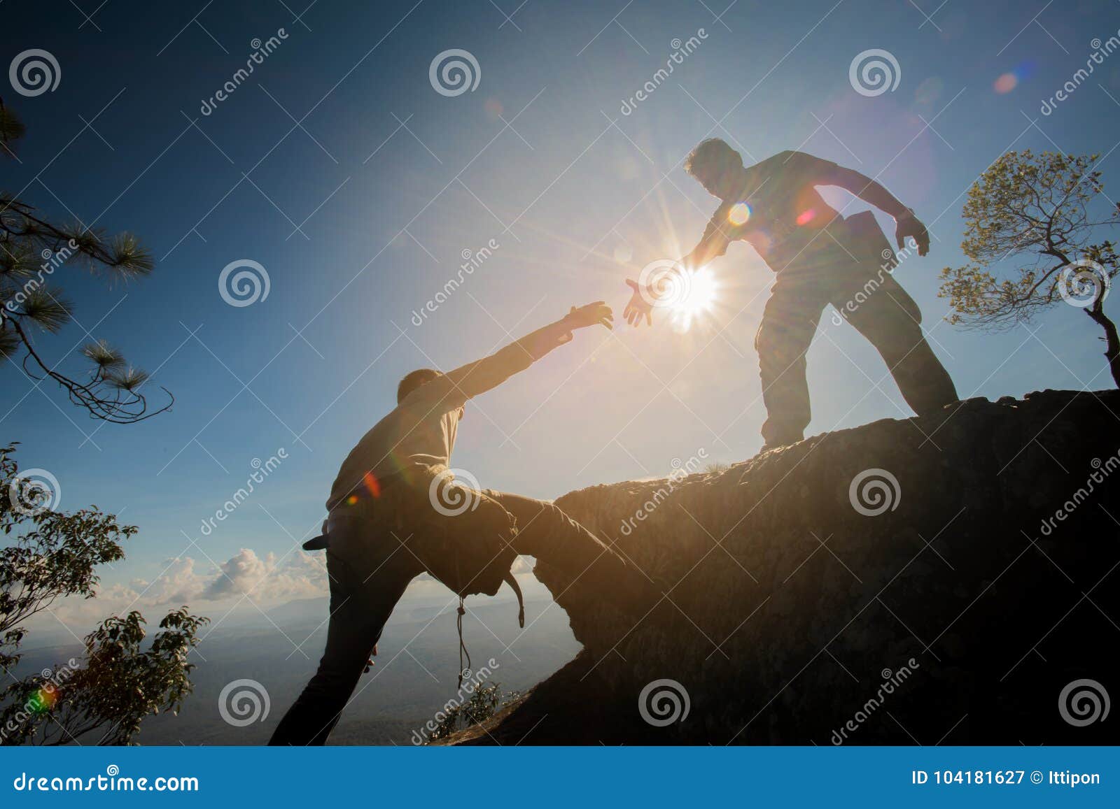 man helping to climb the rock