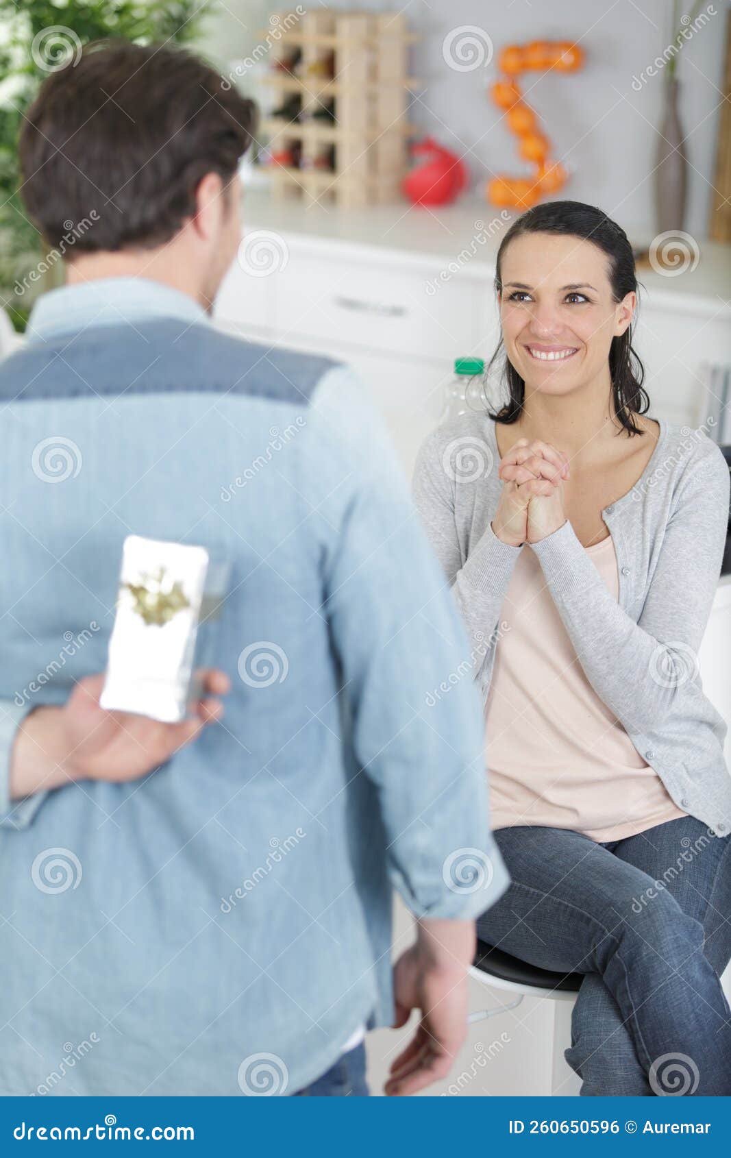Man Hide Surprise Box Gift To Woman on Sofa Stock Photo Image of