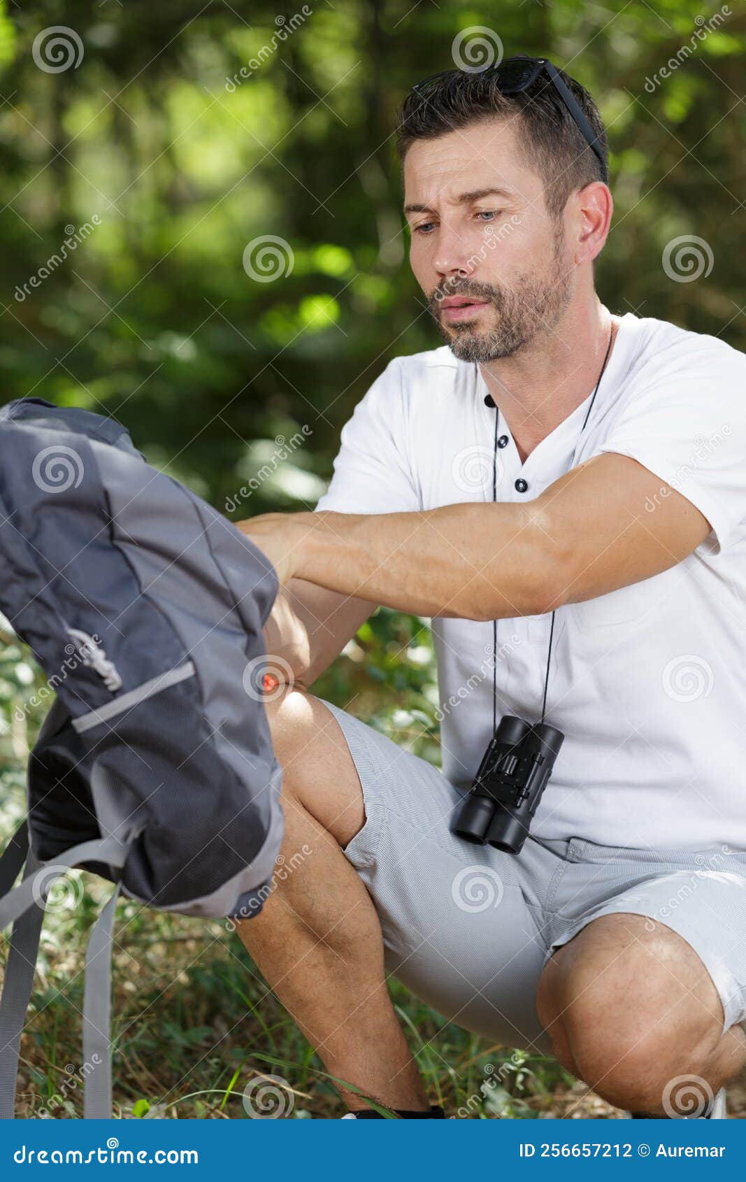 Man Hiker Happy Bends Looking Inside Backpack Stock Photo - Image of ...