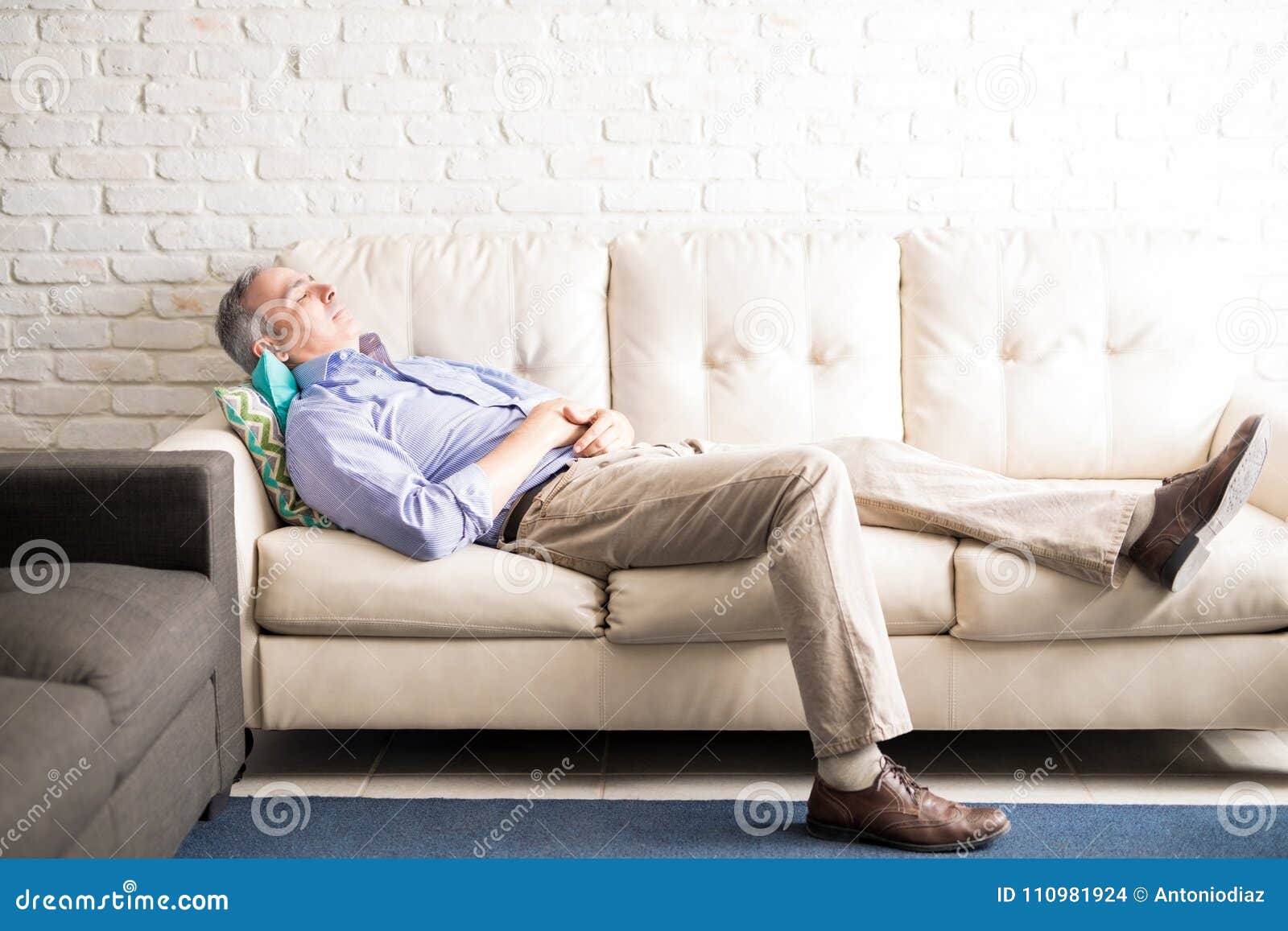 Middle Aged Man Taking A Nap On Couch Stock Photo Image Of Living