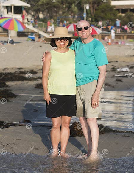 Man And His Wife Having Fun On The Beach Stock Image Image Of Edge Smiling 84121169