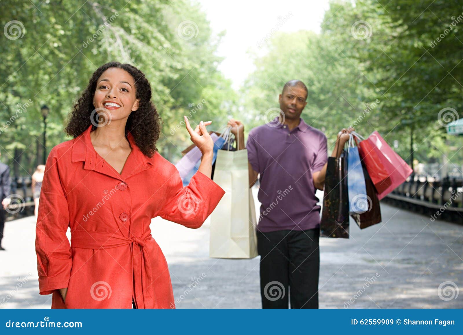 Man holding bags for woman stock image. Image of adult 62559909