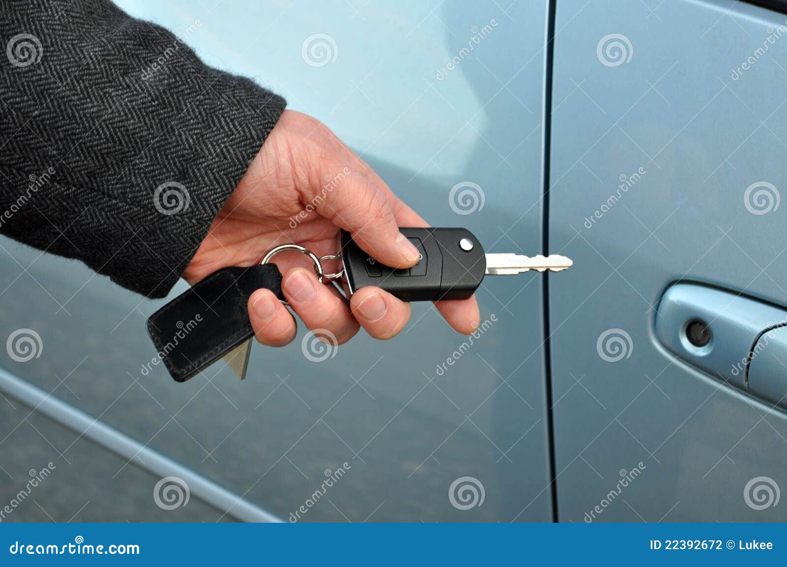 Man holding car key stock photo. Image of driver, business 22392672