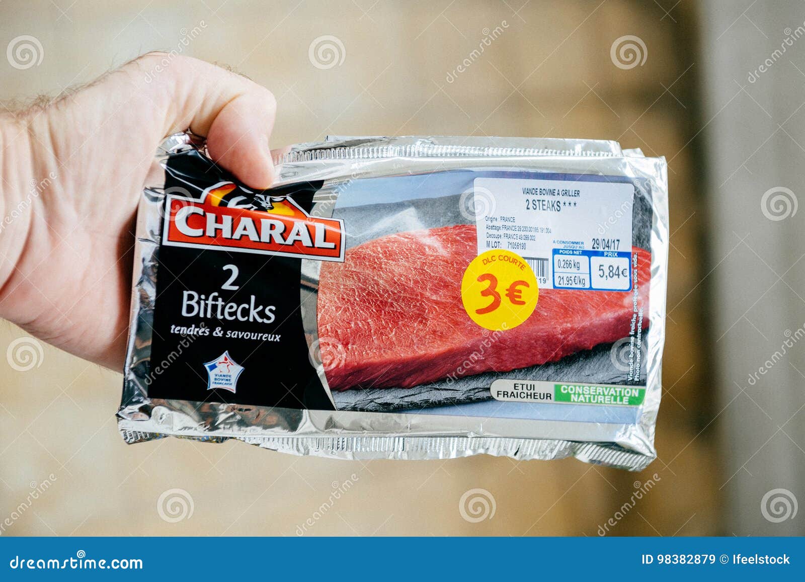 Man Holding Charal Biftecks - Delicious French Meat Editorial