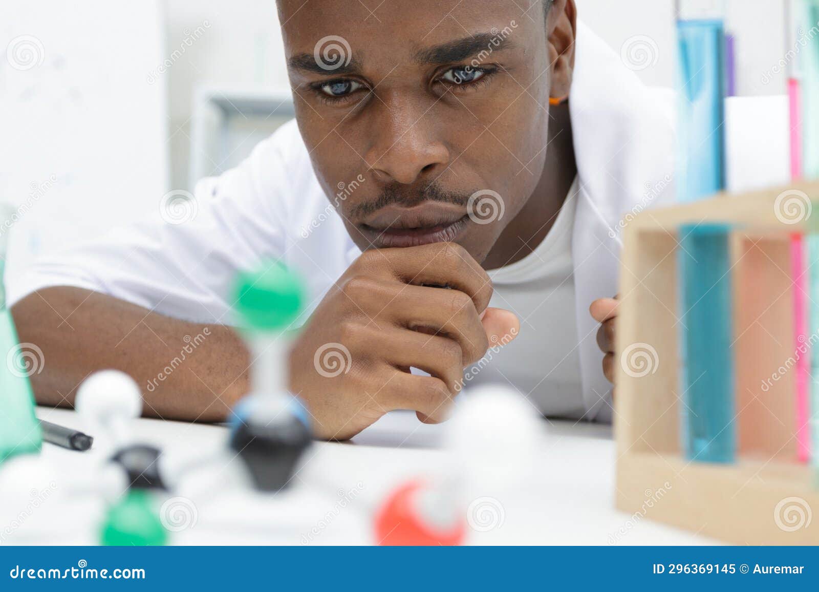 man holding colorful science molecule model