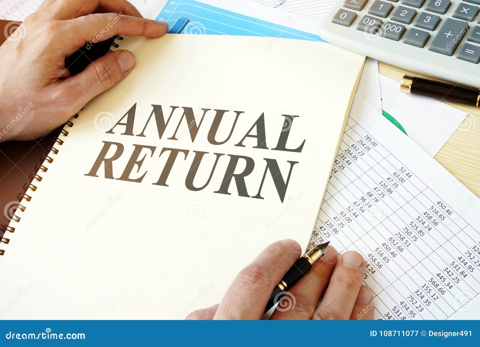 man holding document with annual return.