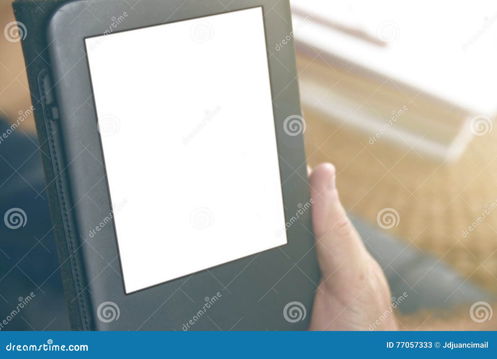 a man holding an ebook reading some documents.