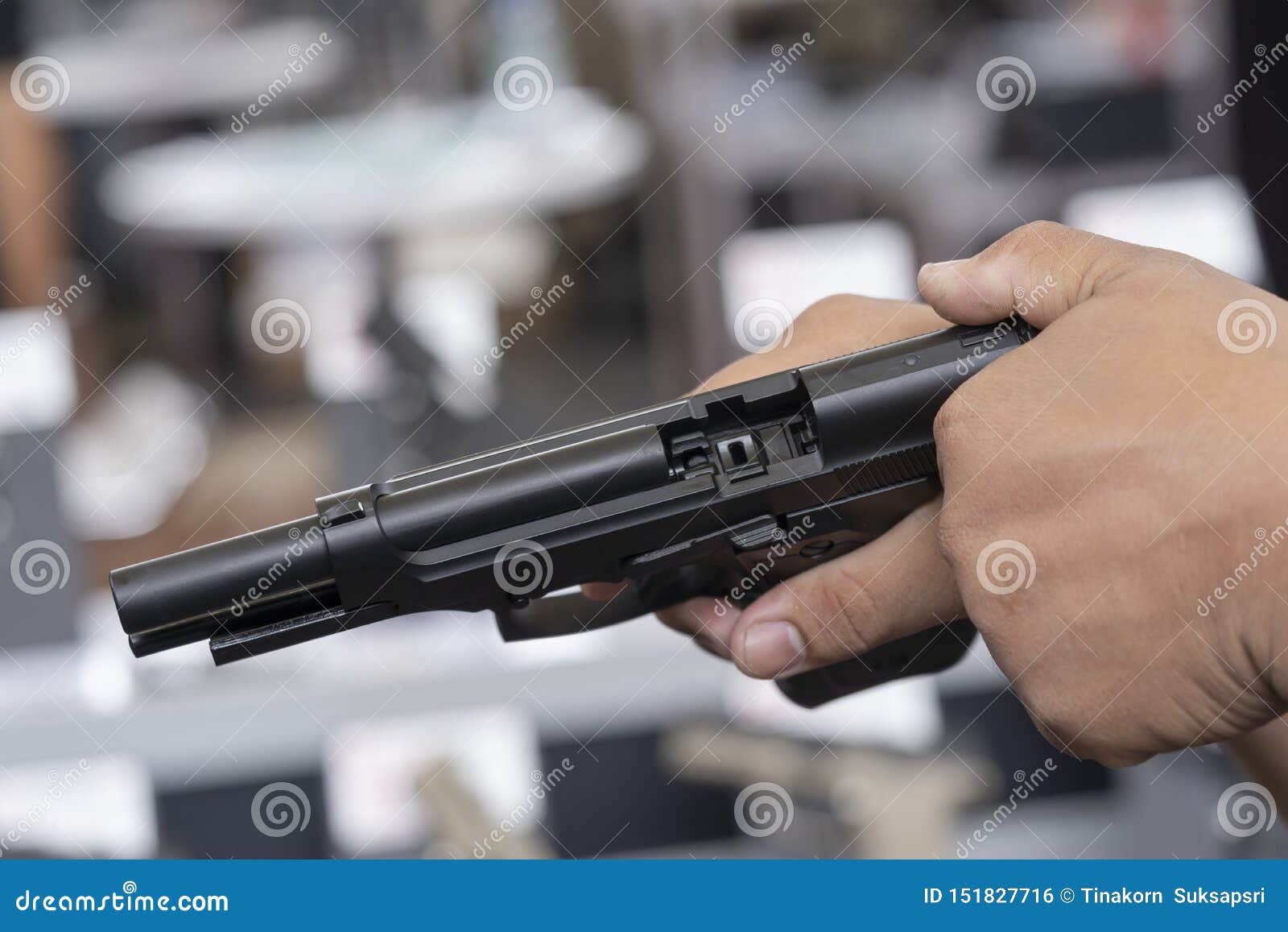 Firearms And Security Topic: Hand Man With A Gun Ready To 