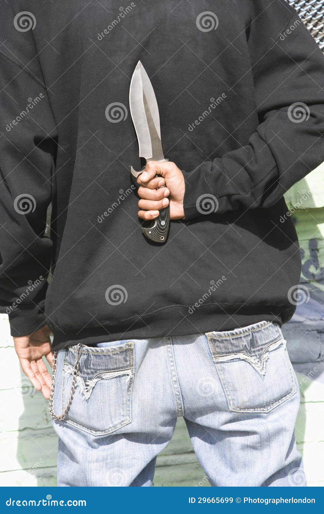 Man Holding Knife Behind Back Stock Image - Image of outdoors, threats