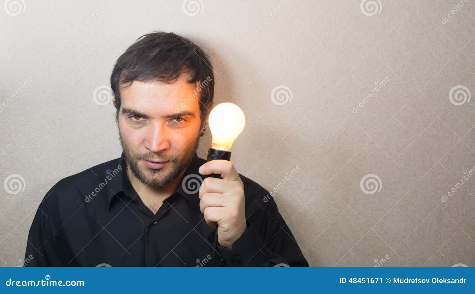 Man holding light bulb stock image. Image of bulb, young 48451671
