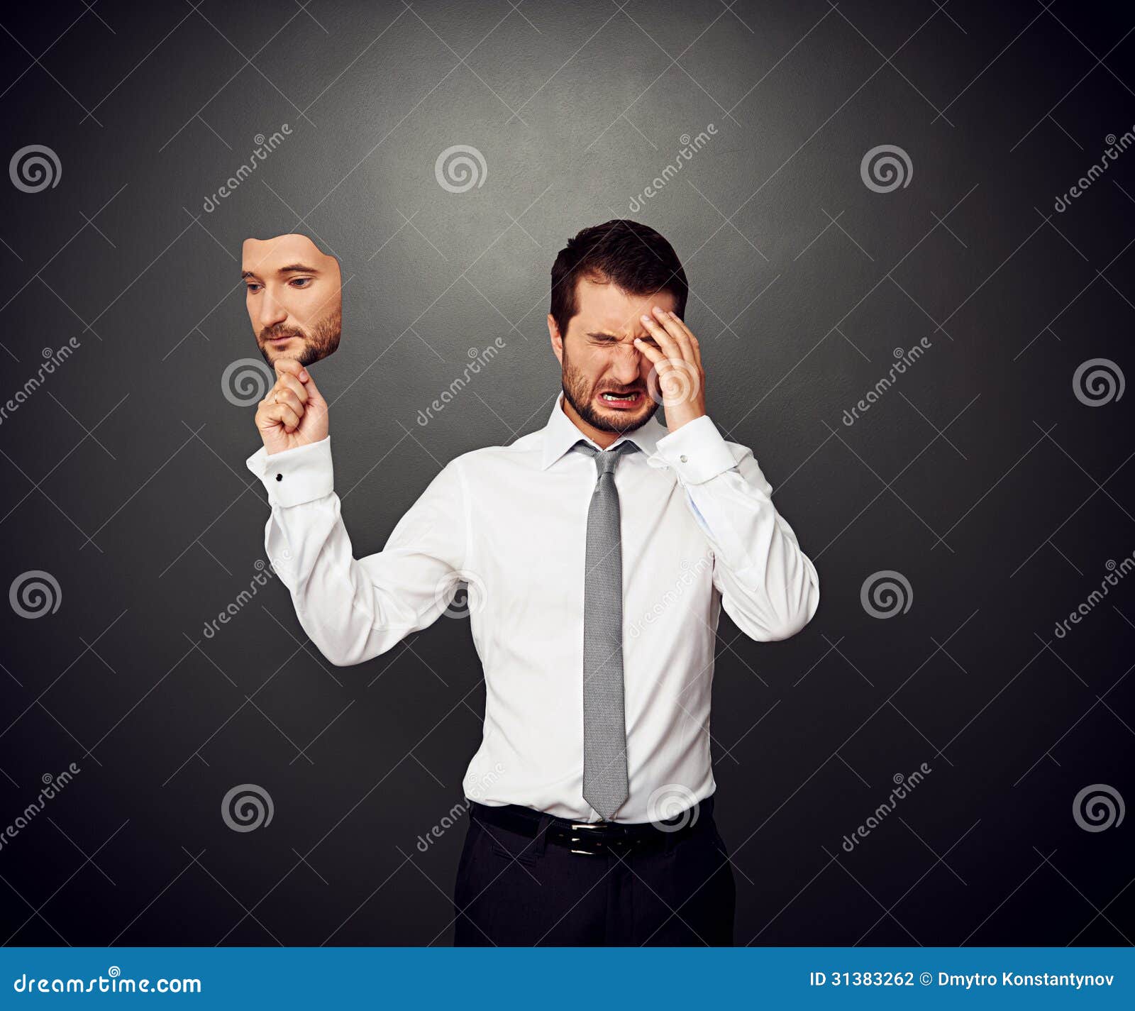 Man Holding Mask with Serious Face Stock Photo Image of emotional