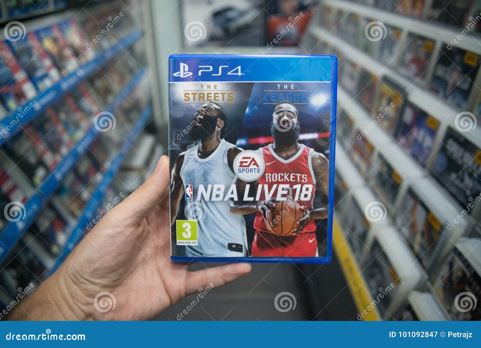 Man Holding NBA Live 18 Videogame on Sony Playstation 4 Console in Store Editorial Photography