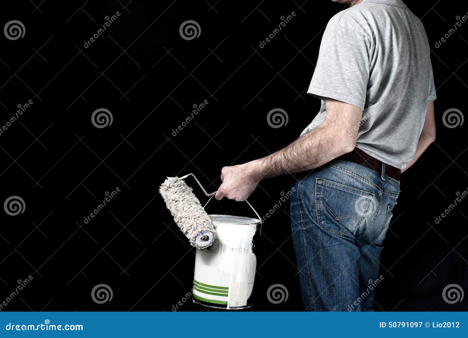Man Holding Paint Roller and a Bucket of Paint Stock Image Image of