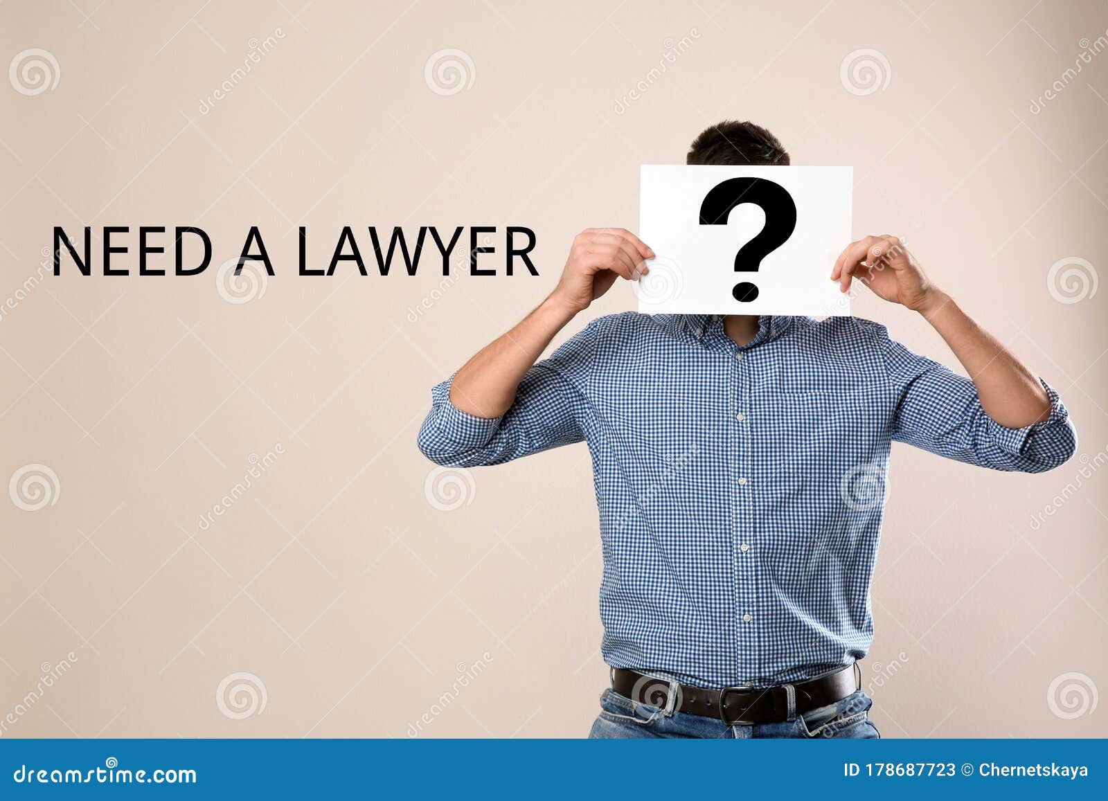 Man Holding Paper With Question Mark And Text NEED A LAWYER? On