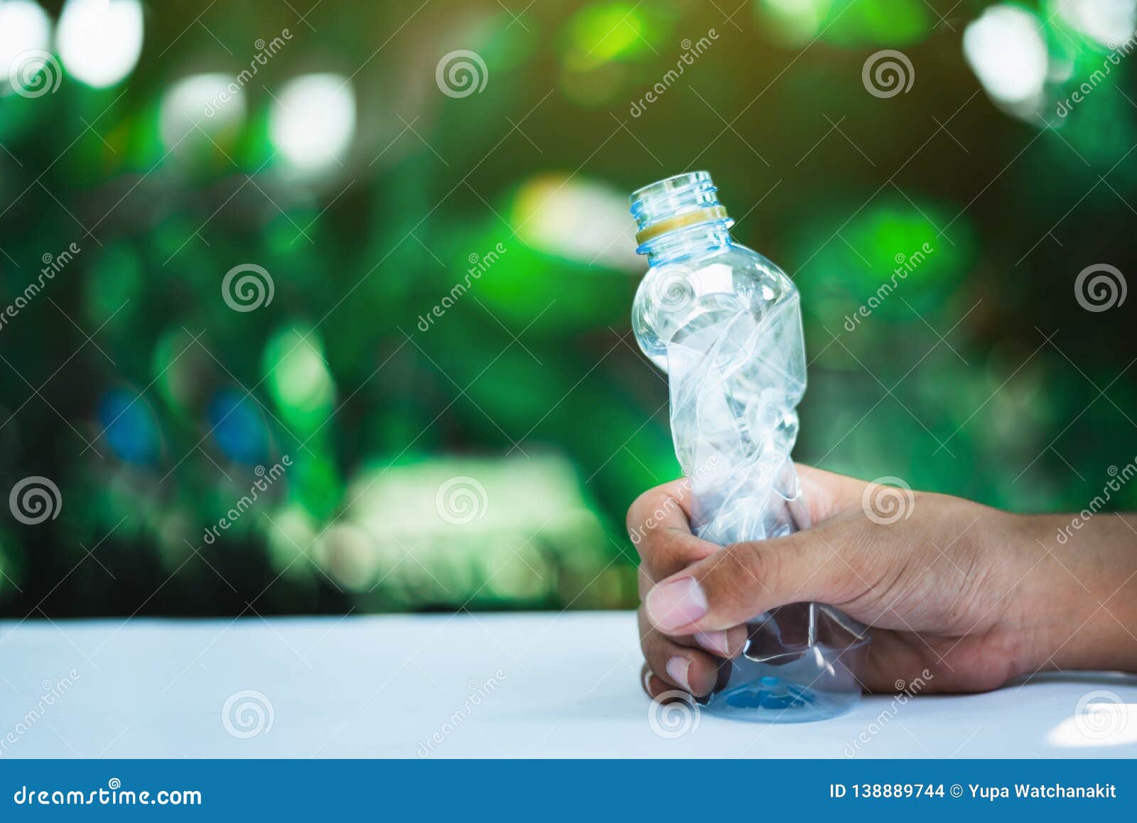 Man holding Plastic bottle stock photo. Image of garbage 138889744