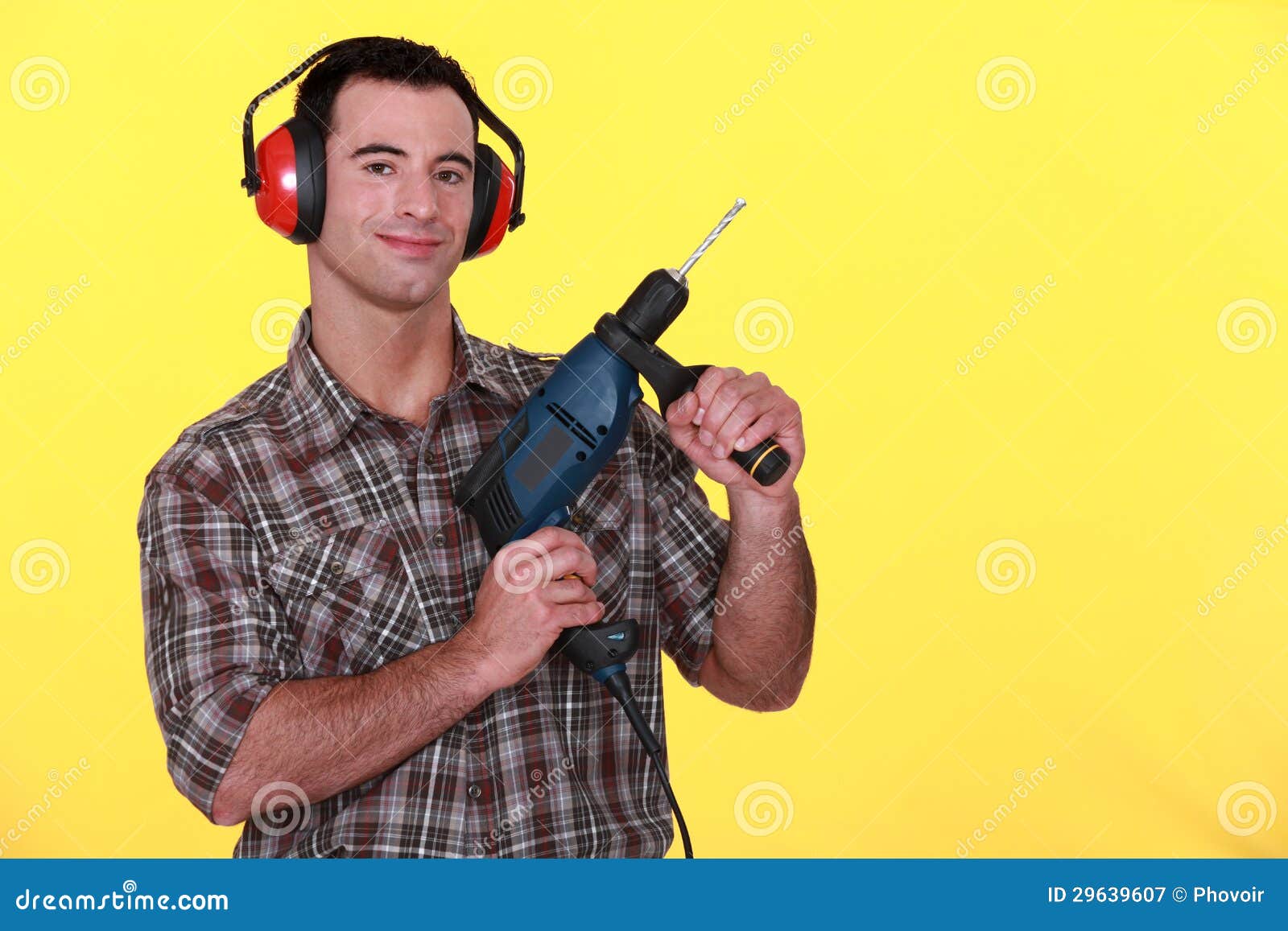 Man holding power drill stock image. Image of protective 29639607