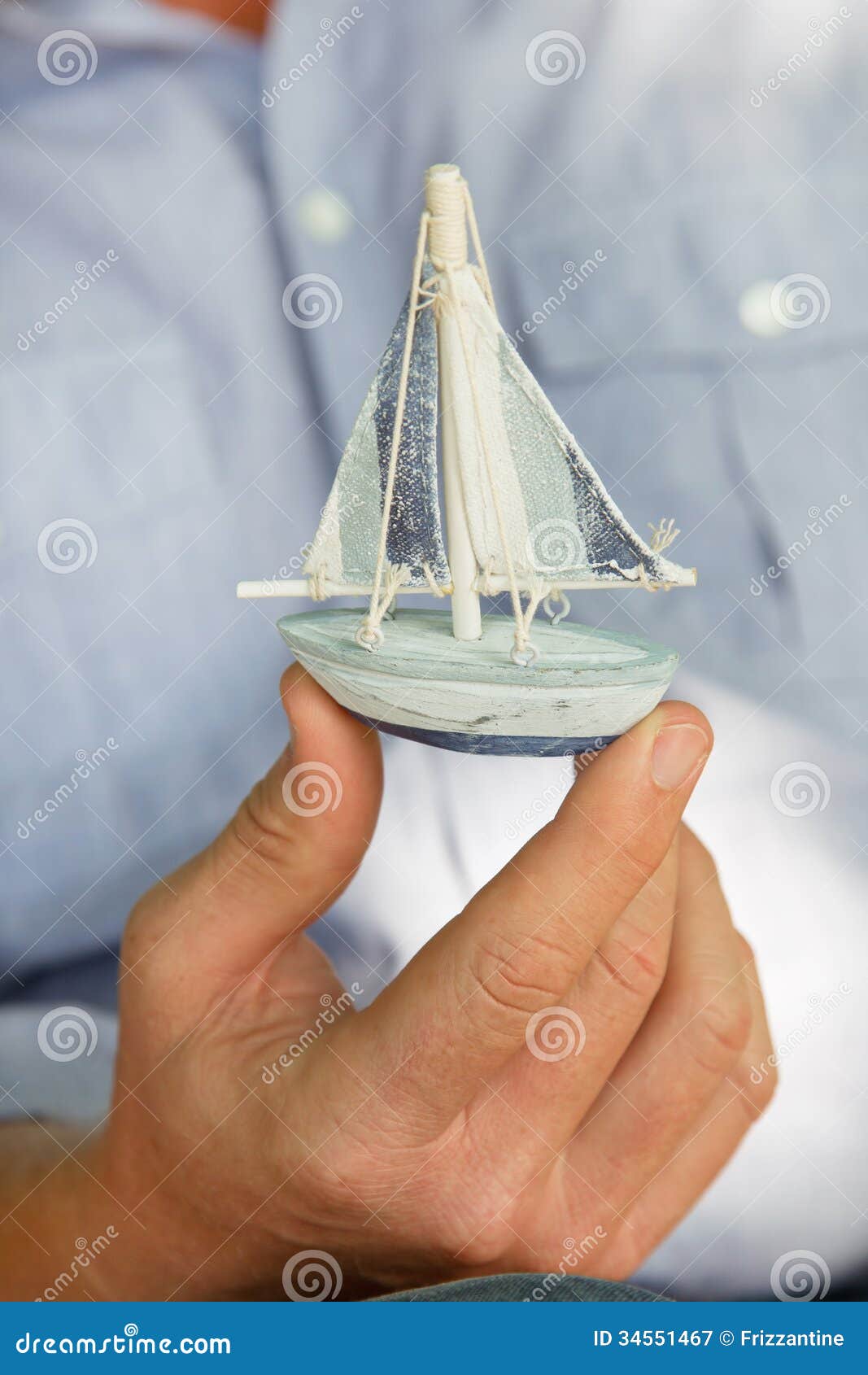 Man Holding A Small Toy Sailing Boat - Concept For Sailing Or Cr 