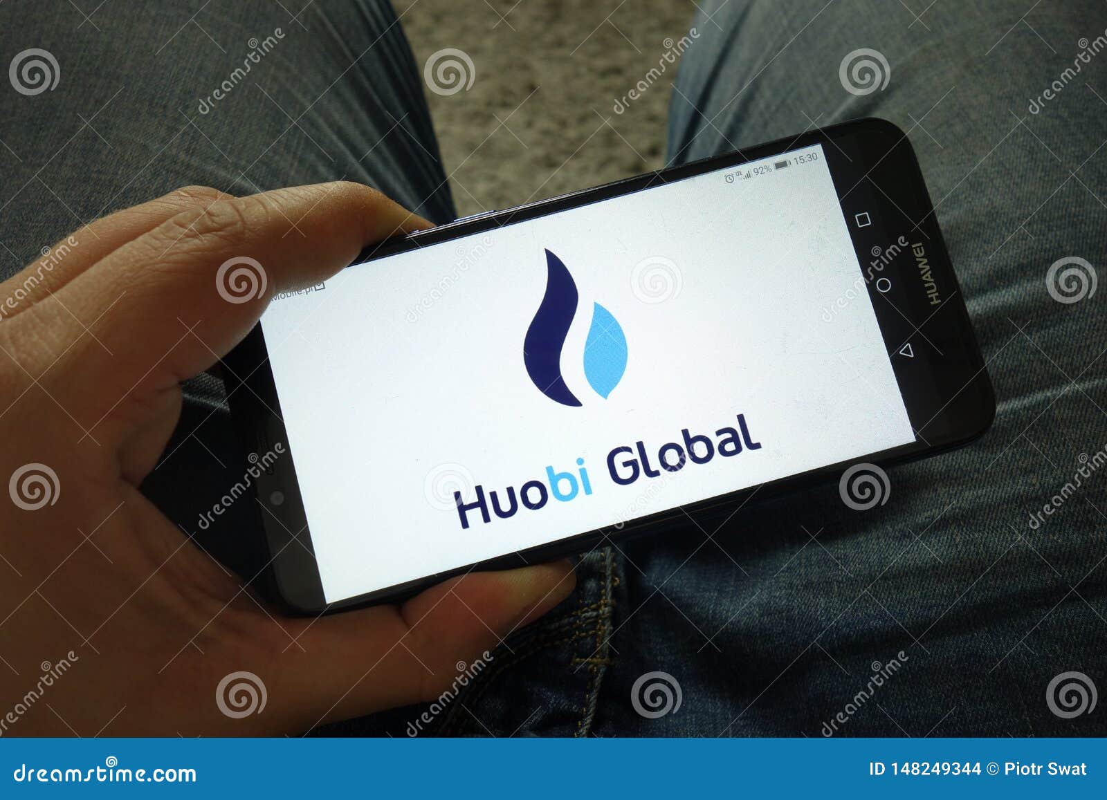 Man Holding Smartphone With Huobi Global Cryptocurrency ...