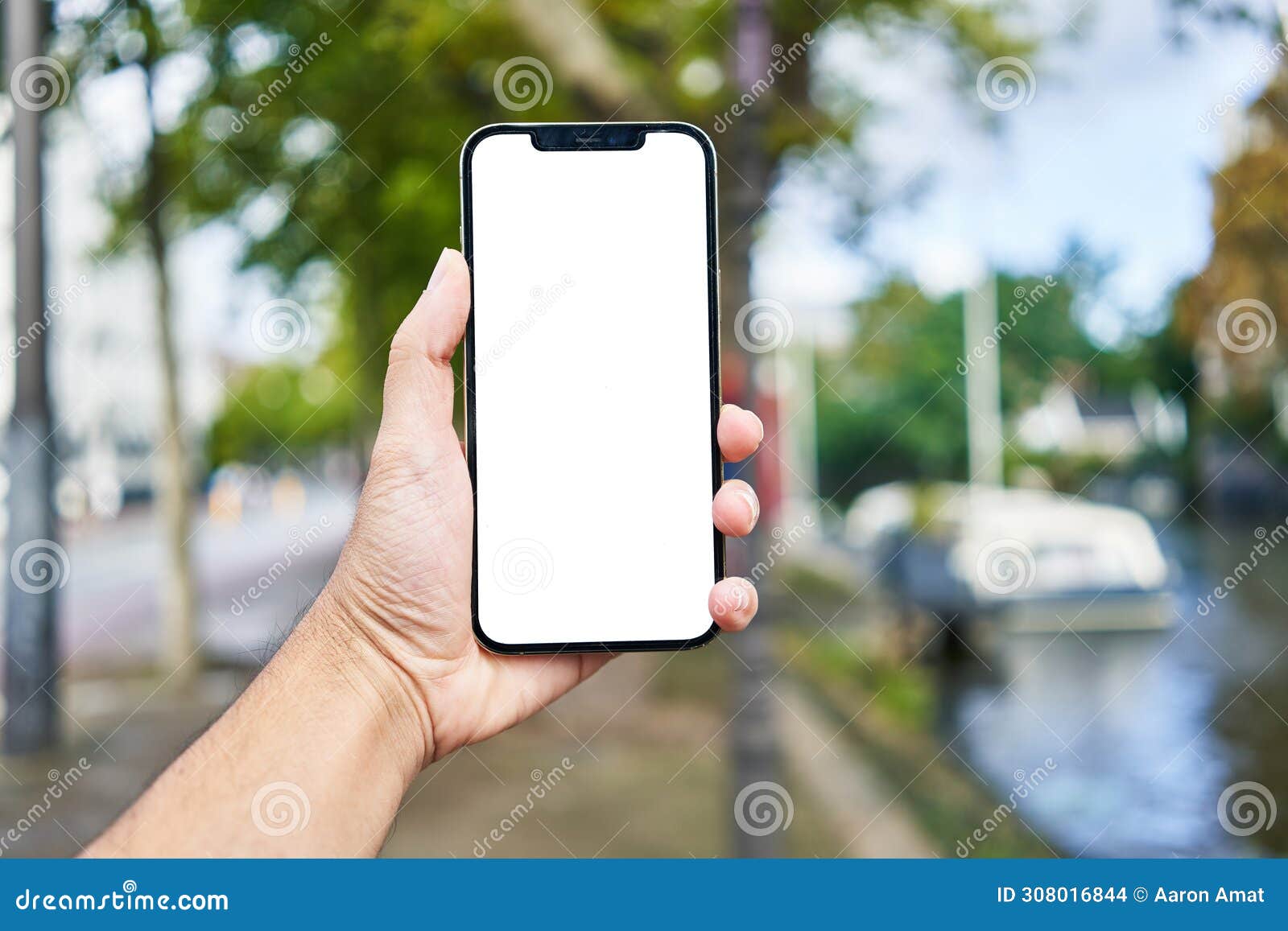 man holding smartphone showing white blank screen at amsterdam