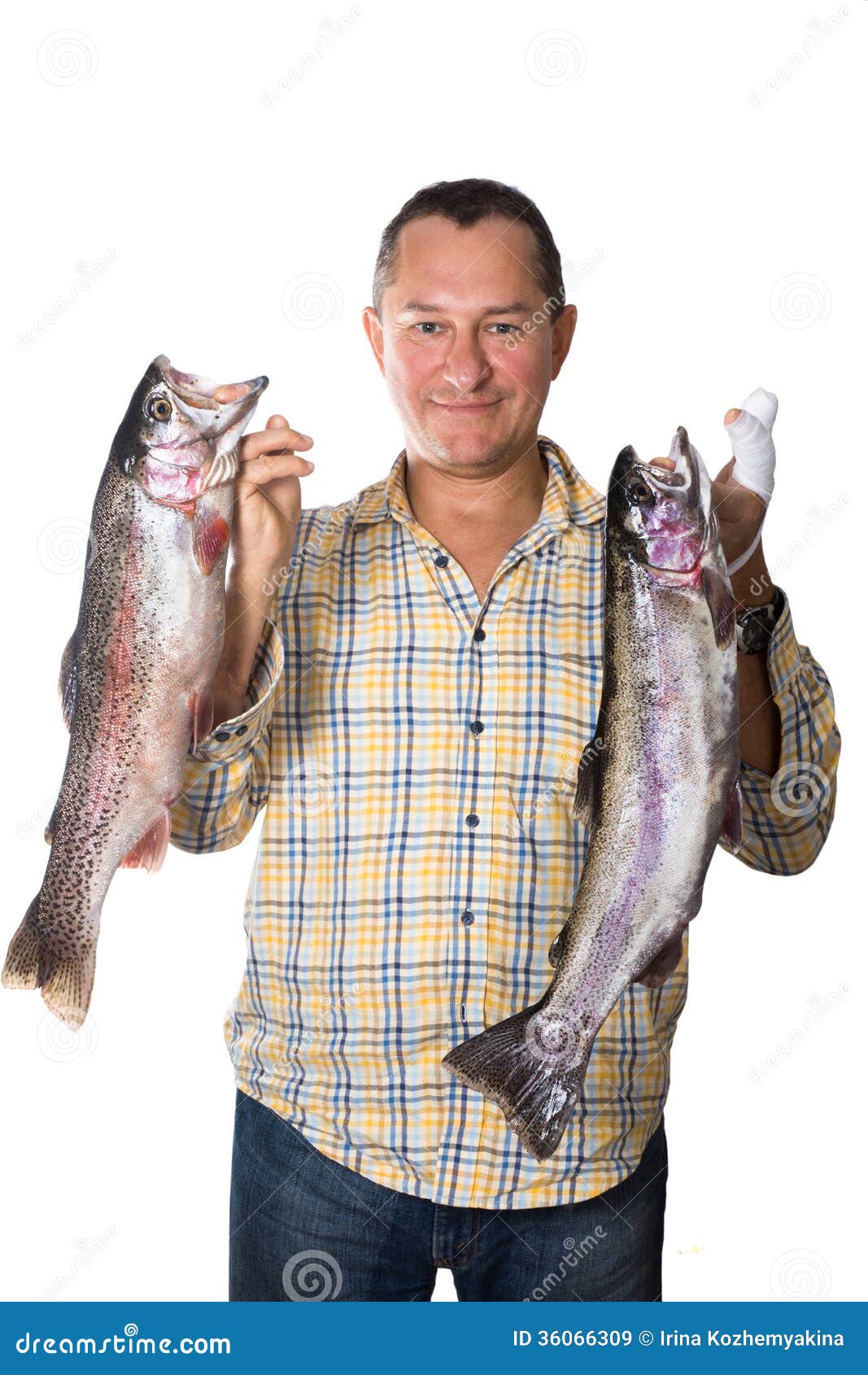 Man Holding Two Large Fresh Fish Trout in the Hands of Stock Image
