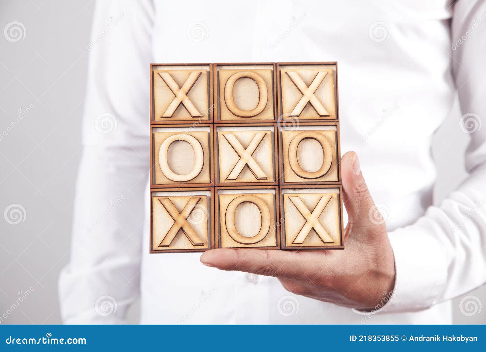 Man Holding Wooden X, O Game Stock Image Image of hand, skill 218353855