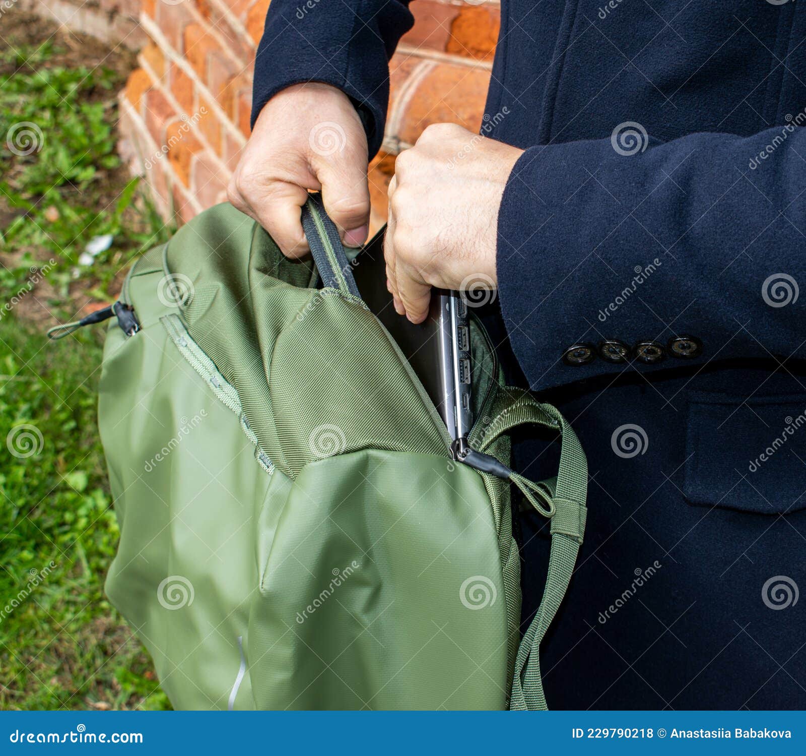 A Man Holds a Bag by the Handle and Takes Out a Laptop. Universal City Sports  Bag in Khaki Color. Stock Photo - Image of caucasian, background: 229790218
