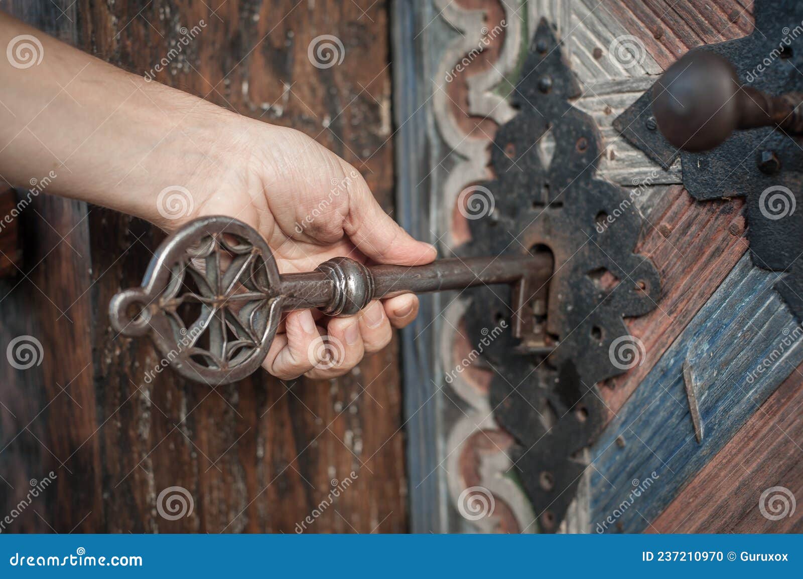 man-holds-huge-key-hand-unlocks-large-door-closeup-detail-view-man-holds-huge-massive-medieval-church-key-his-hand-237210970.jpg