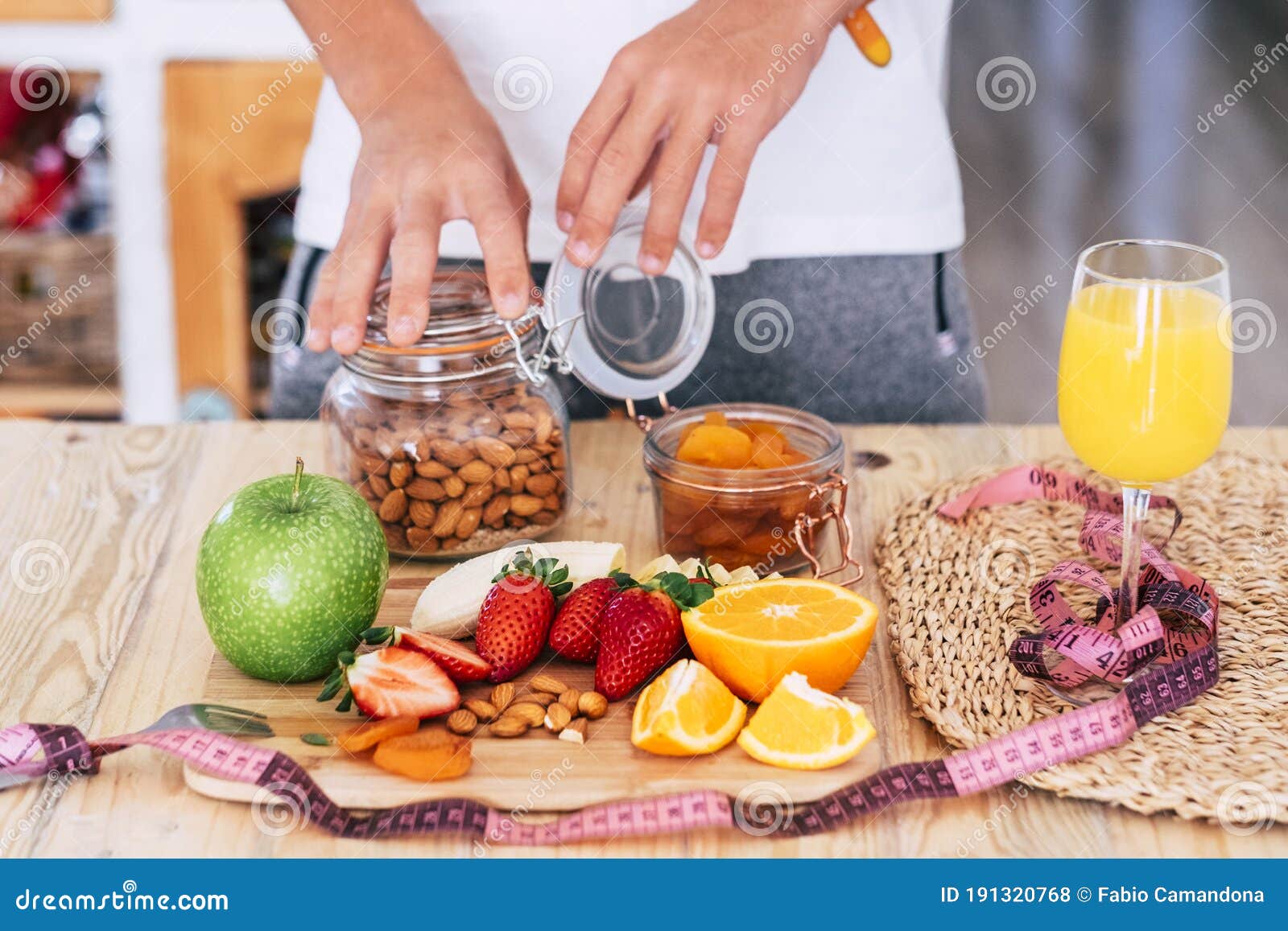 man at home touching and eating fruits - indoor and sane lifestyle concept