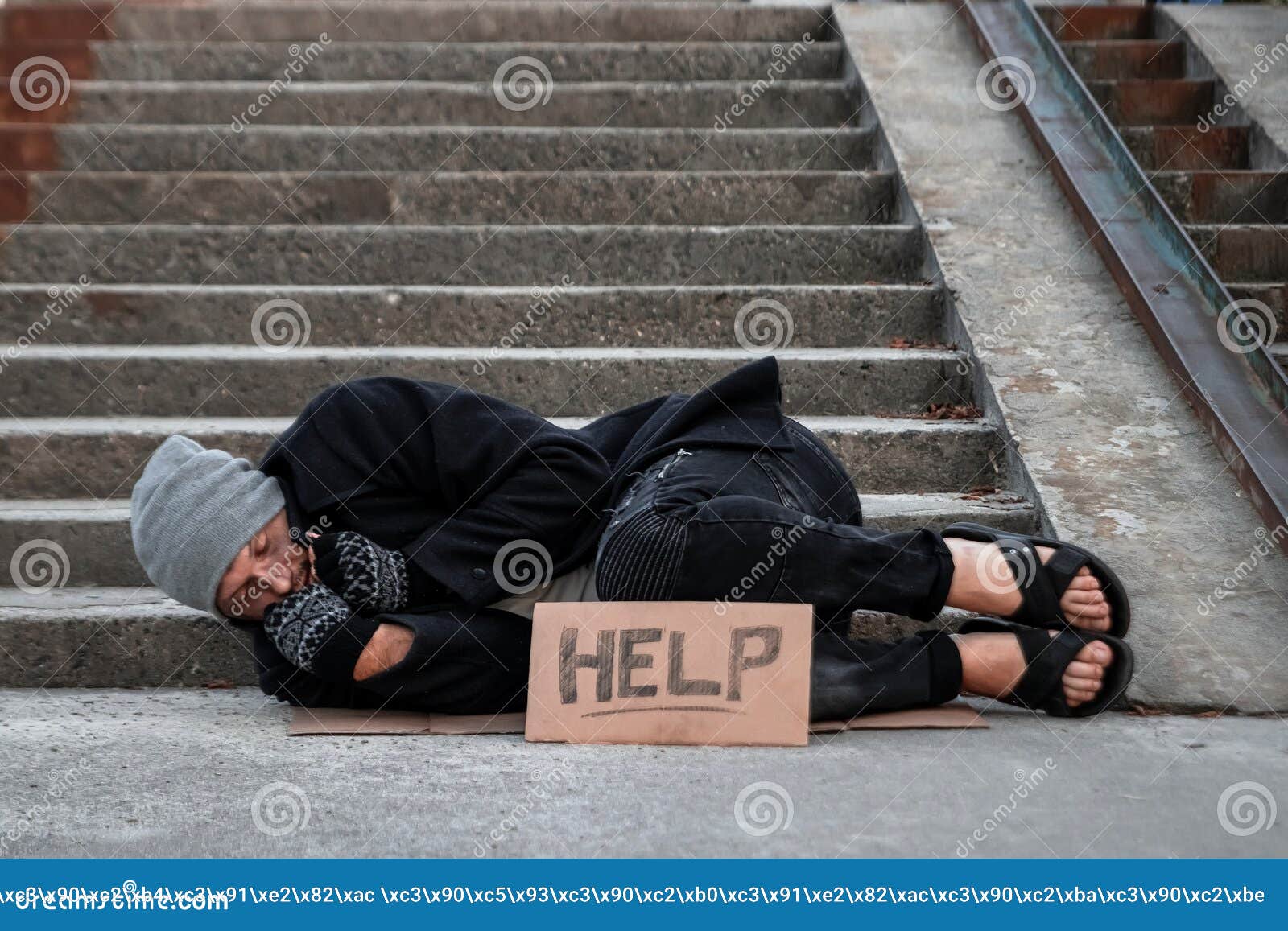 A Man Homeless A Man Sleeping On A Cold Floor In The Street With