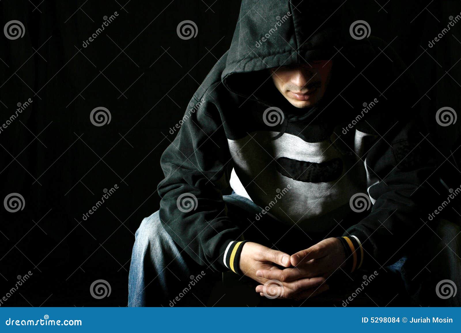 Man in Hooded Top in Thoughtful Pose Stock Photo - Image of ...