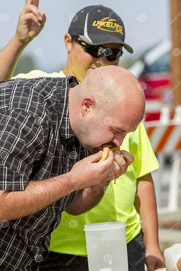 Man at Hot Dog Eating Contest. Editorial Photography Image of shove