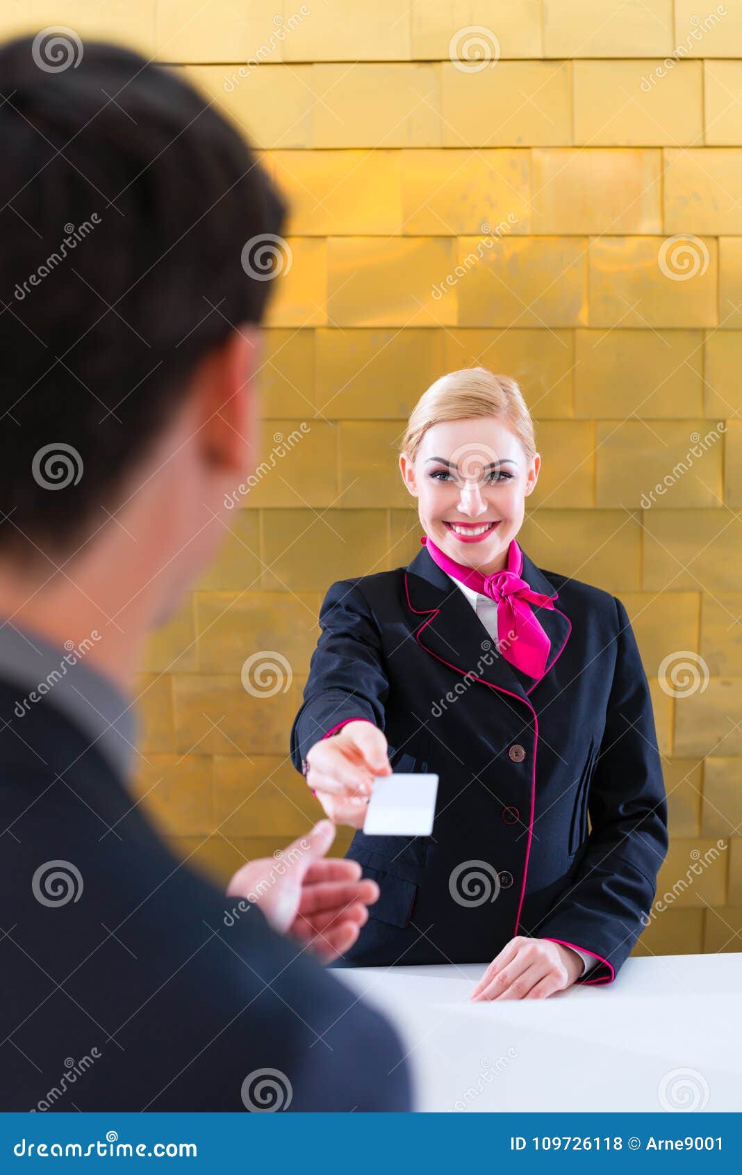 Hotel Receptionist Check In Man Giving Key Card Stock