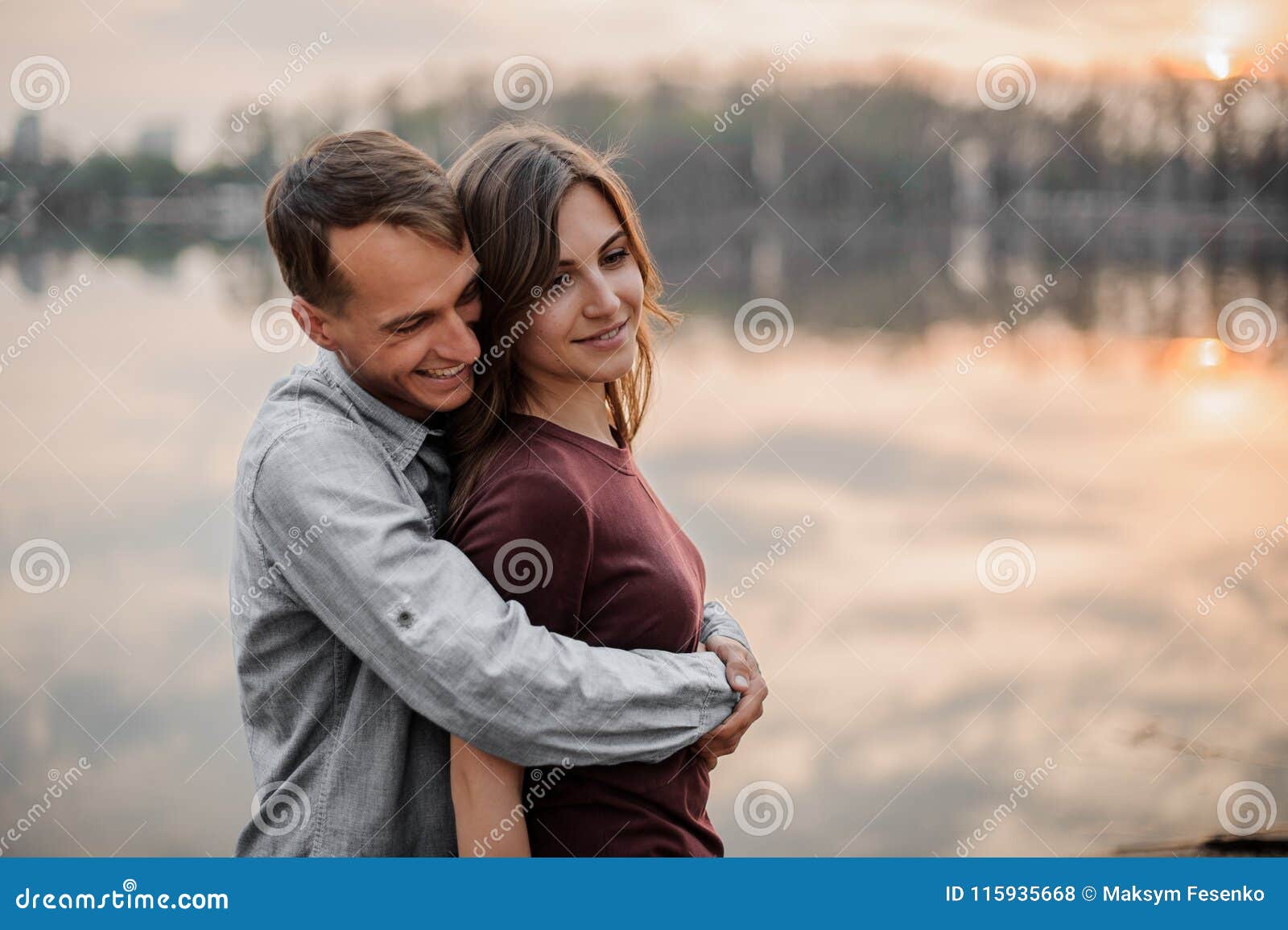 Man Hugging From Behind His Woman On The Background Of Lake Stock Photo Image Of Hipster Emotions Man Hugging From Behind His Woman On The Background Of Lake Stock Photo Image Of Hipster Emotions