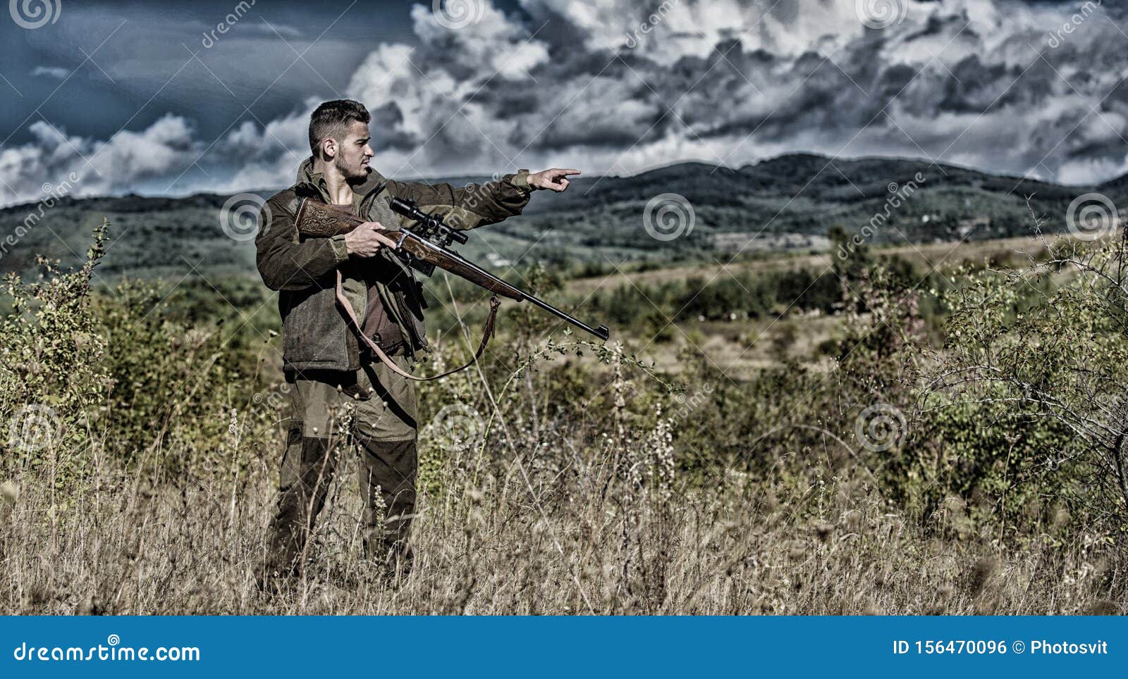 man hunter aiming rifle nature background. experience and practice lends success hunting. guy hunting nature environment