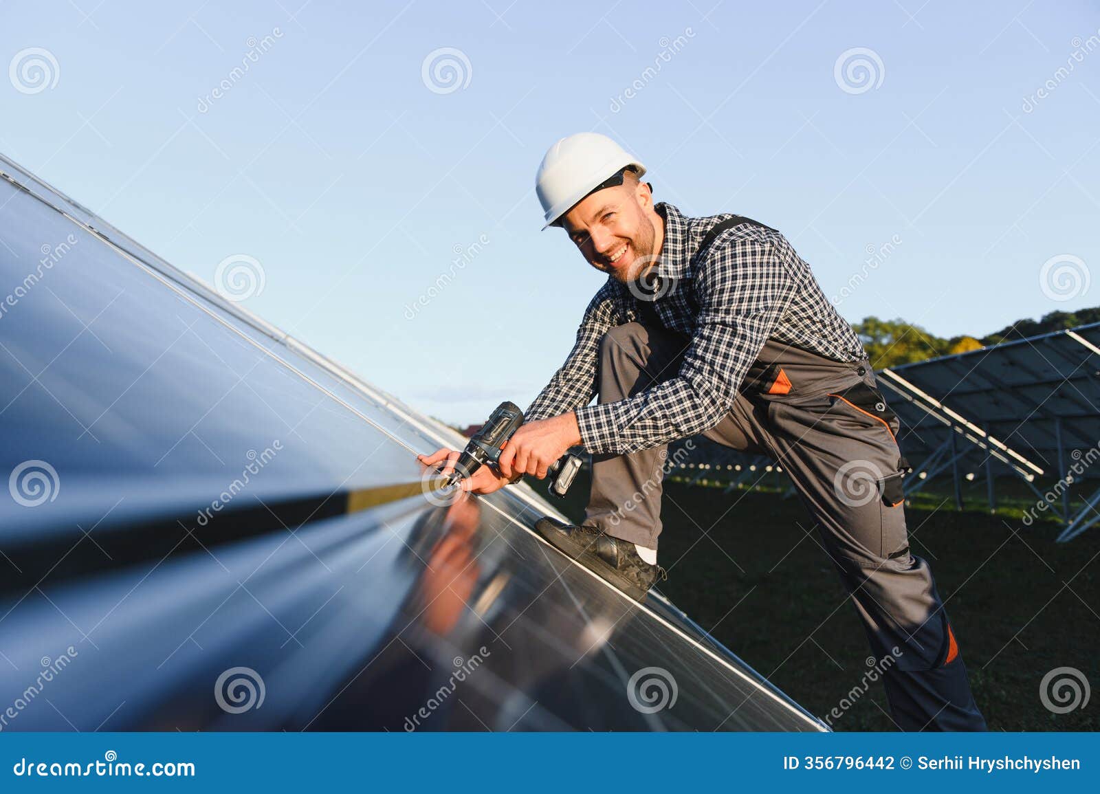 man installer installing photovoltaic solar moduls. concept of alternative and renewable energy