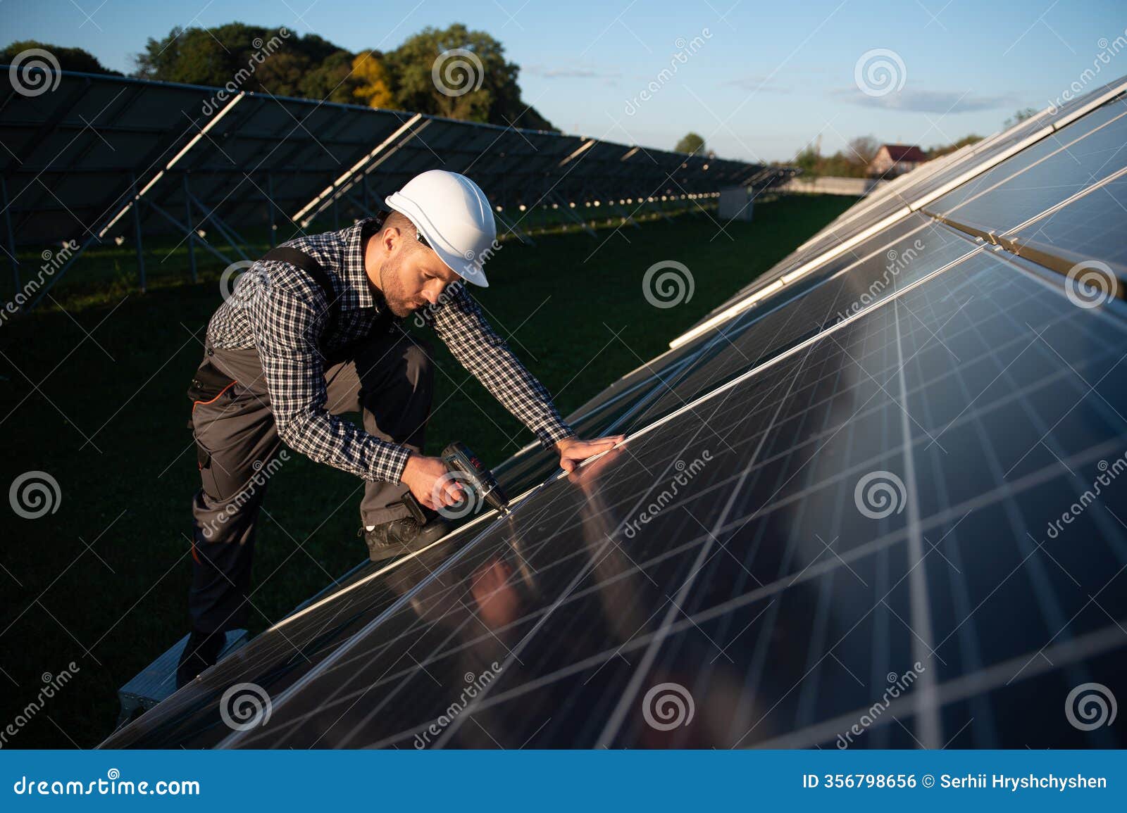 man installer installing photovoltaic solar moduls. concept of alternative and renewable energy