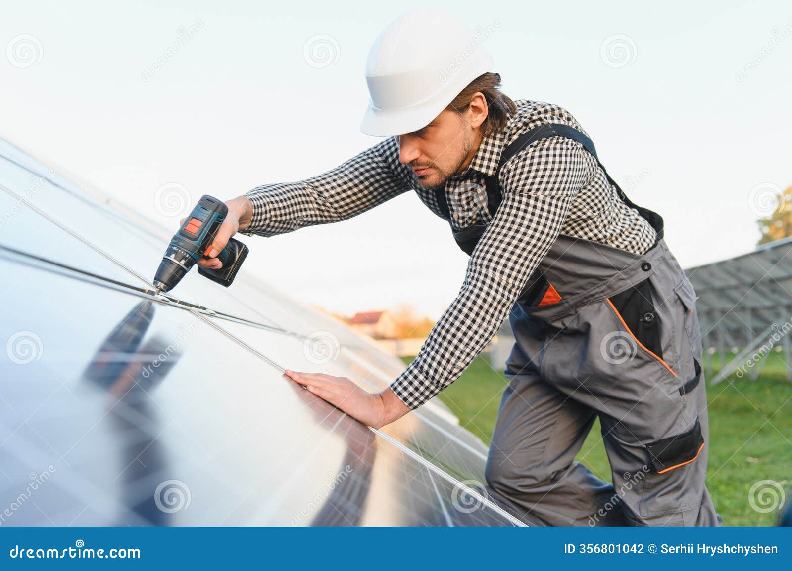 man installer installing photovoltaic solar moduls. concept of alternative and renewable energy