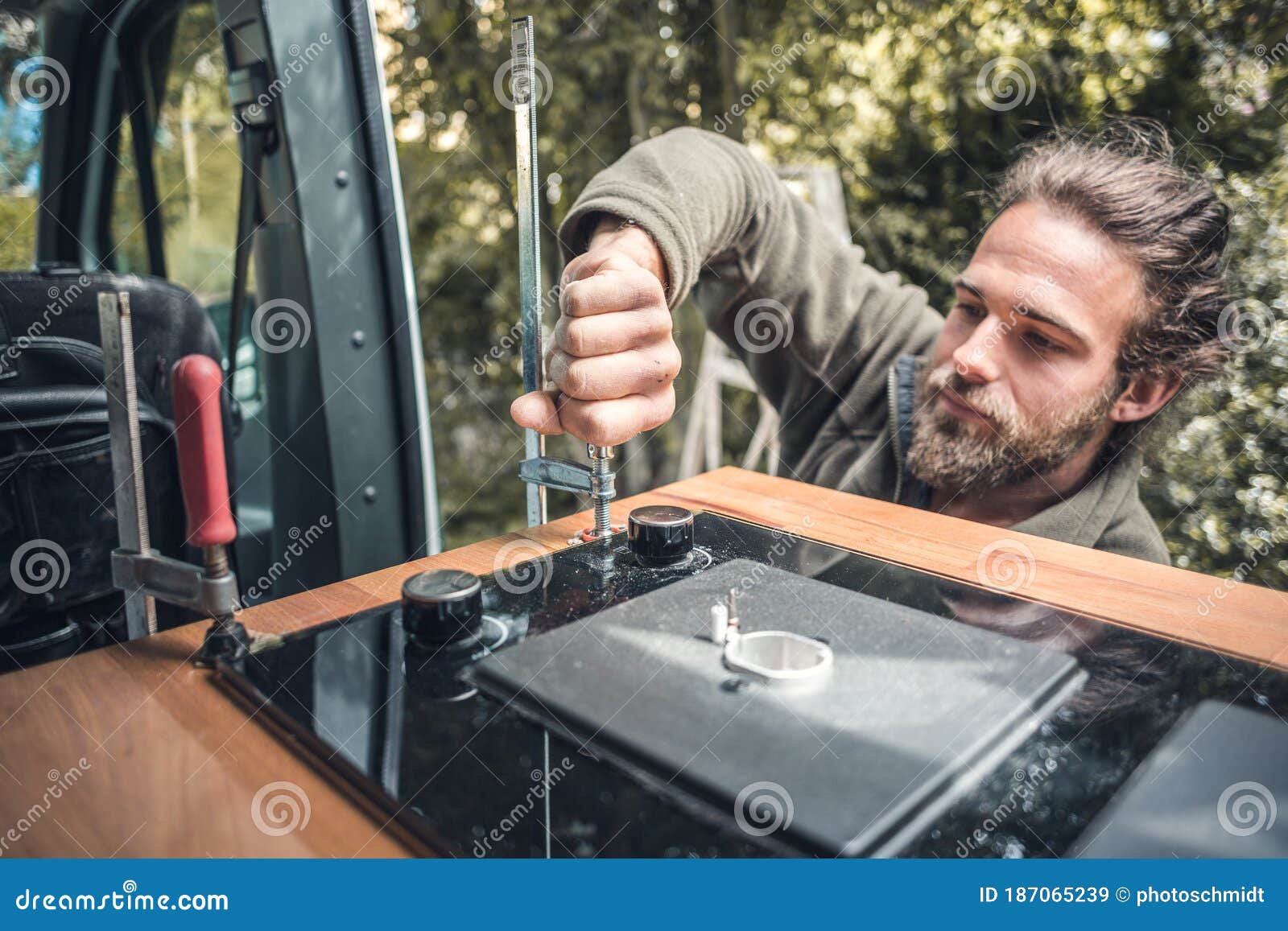 Man Installing a Gas Stove into a Camper Van Stock Image Image of