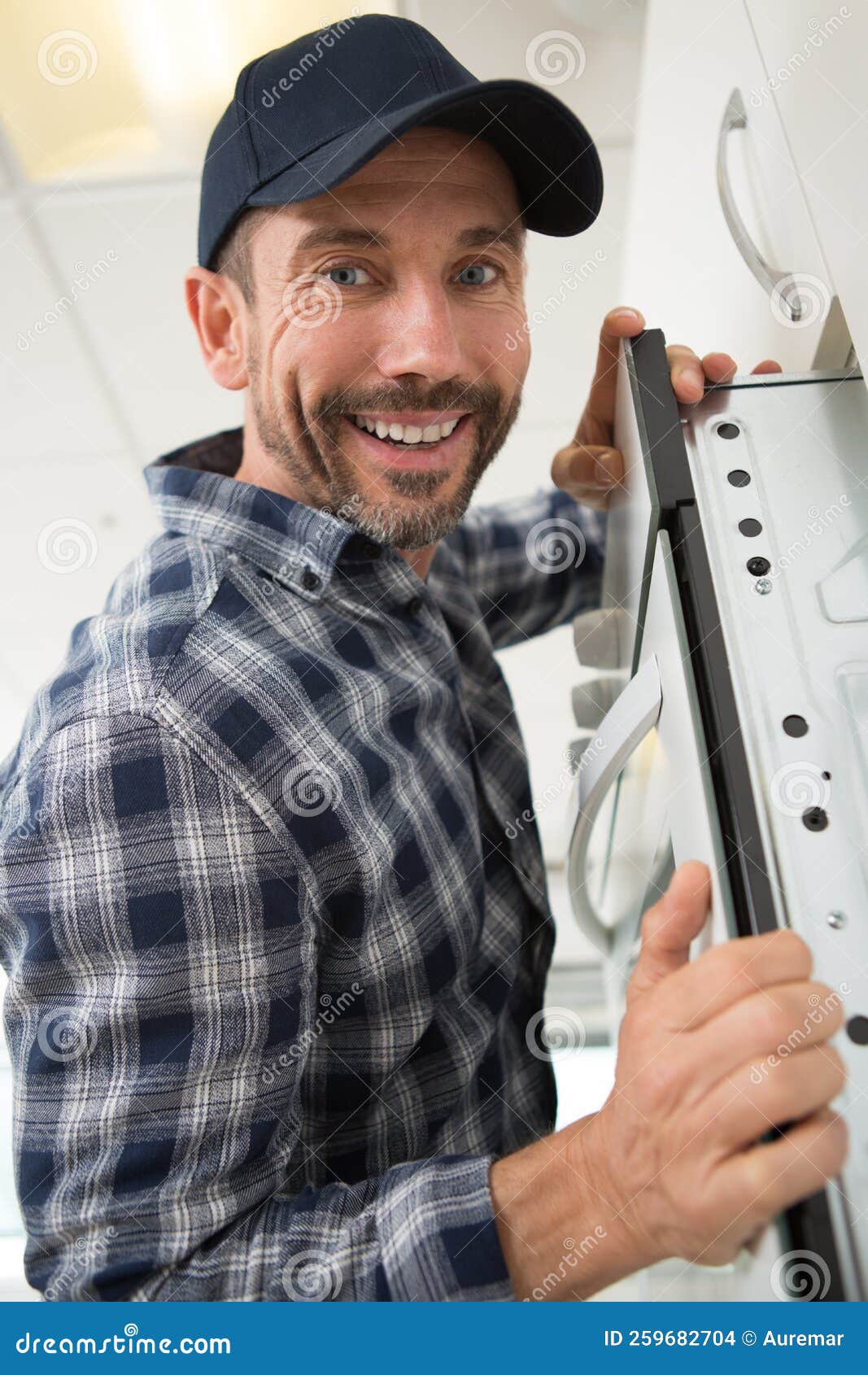 Man Installing Oven Inside Kitchen Furniture Stock Photo Image of