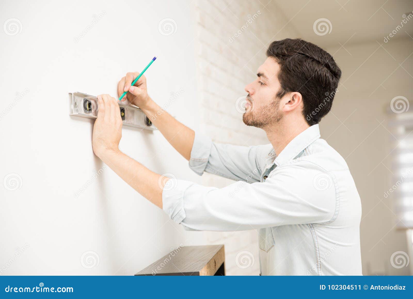 Man Installing a Shelf at Home Stock Image Image of lifestyle, shelf