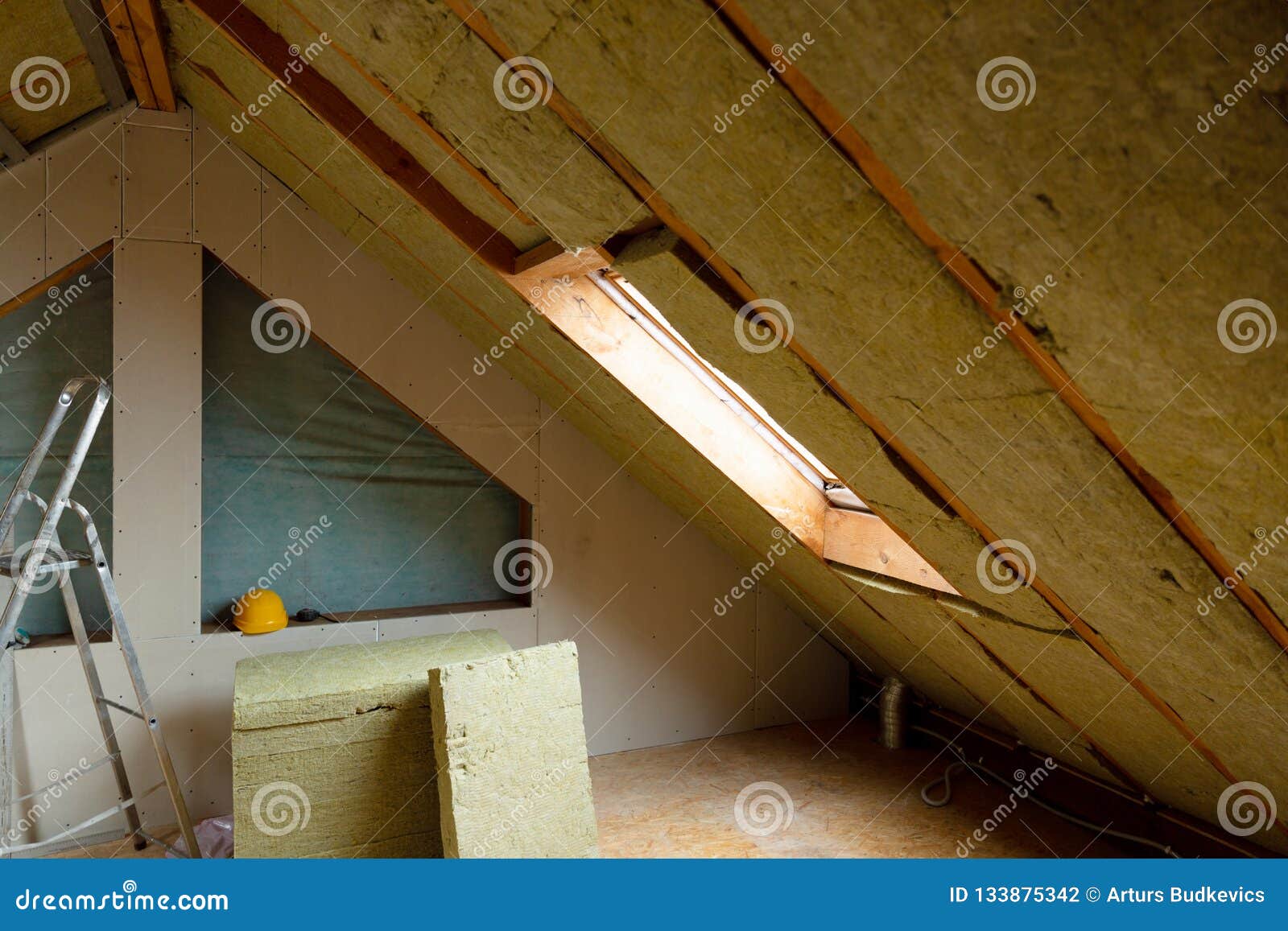 Man Installing Thermal Roof Insulation Layer Using Mineral