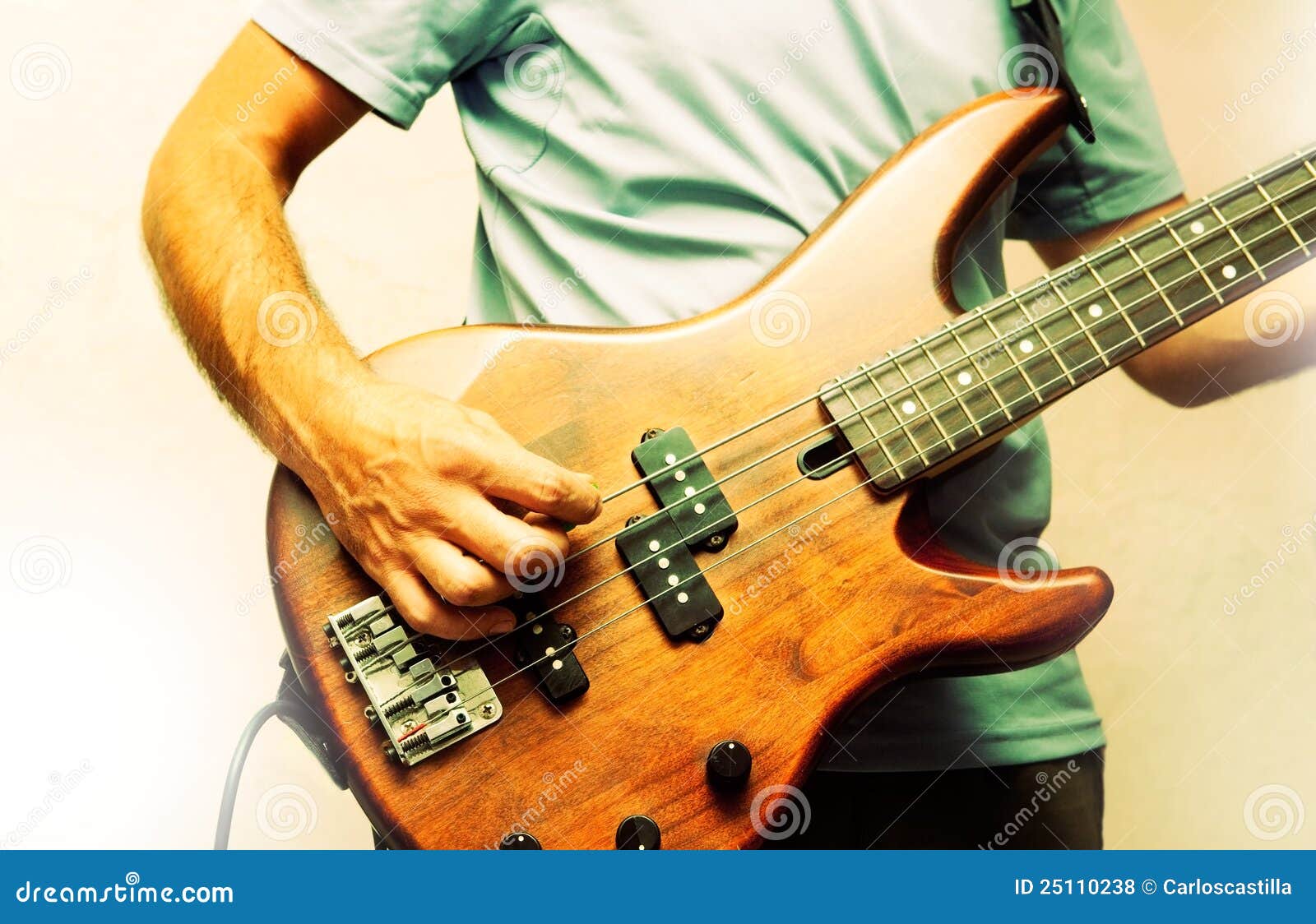 Man and instrument stock photo. Image of light, bass 25110238