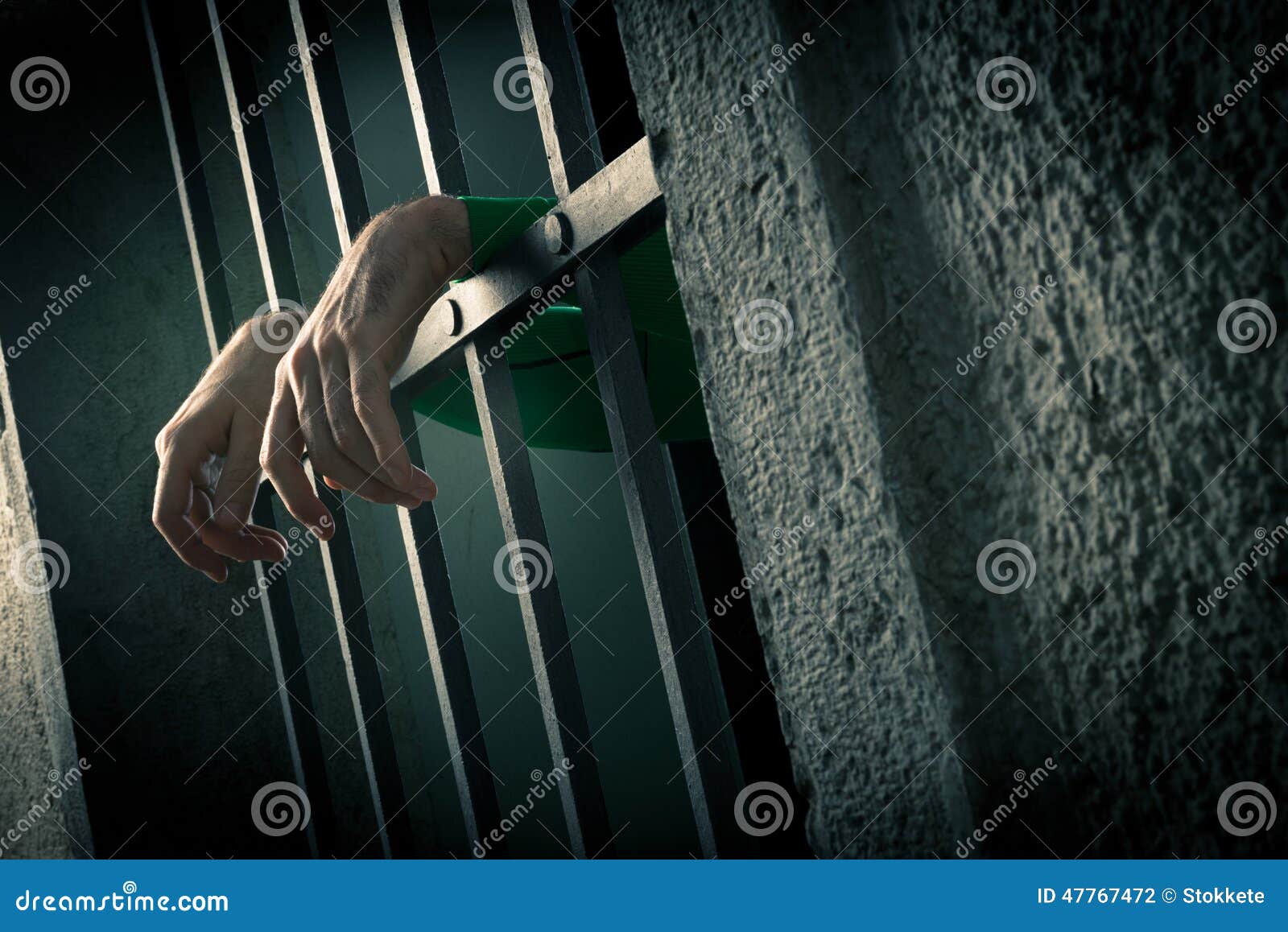 man in jail hands close-up
